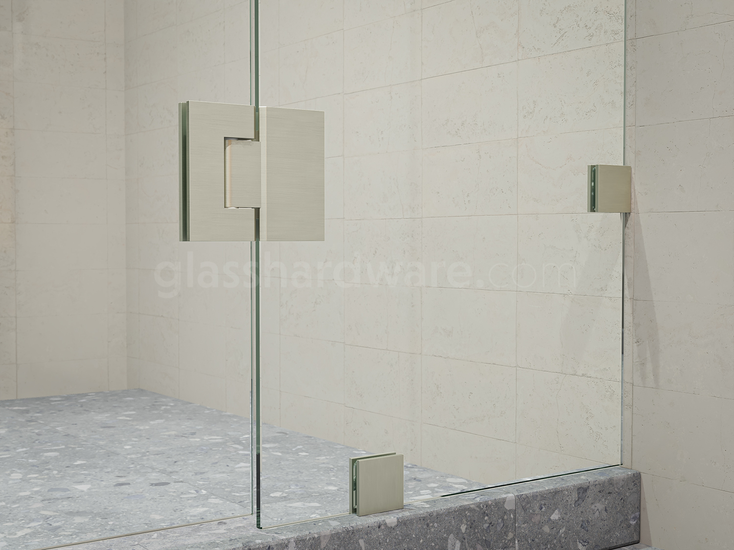 A close up of the Heavy Duty Glass-to-Glass 180 Degree Malibu Hinge installed on a frameless shower door, showcasing its Solid Brass construction in more detail.