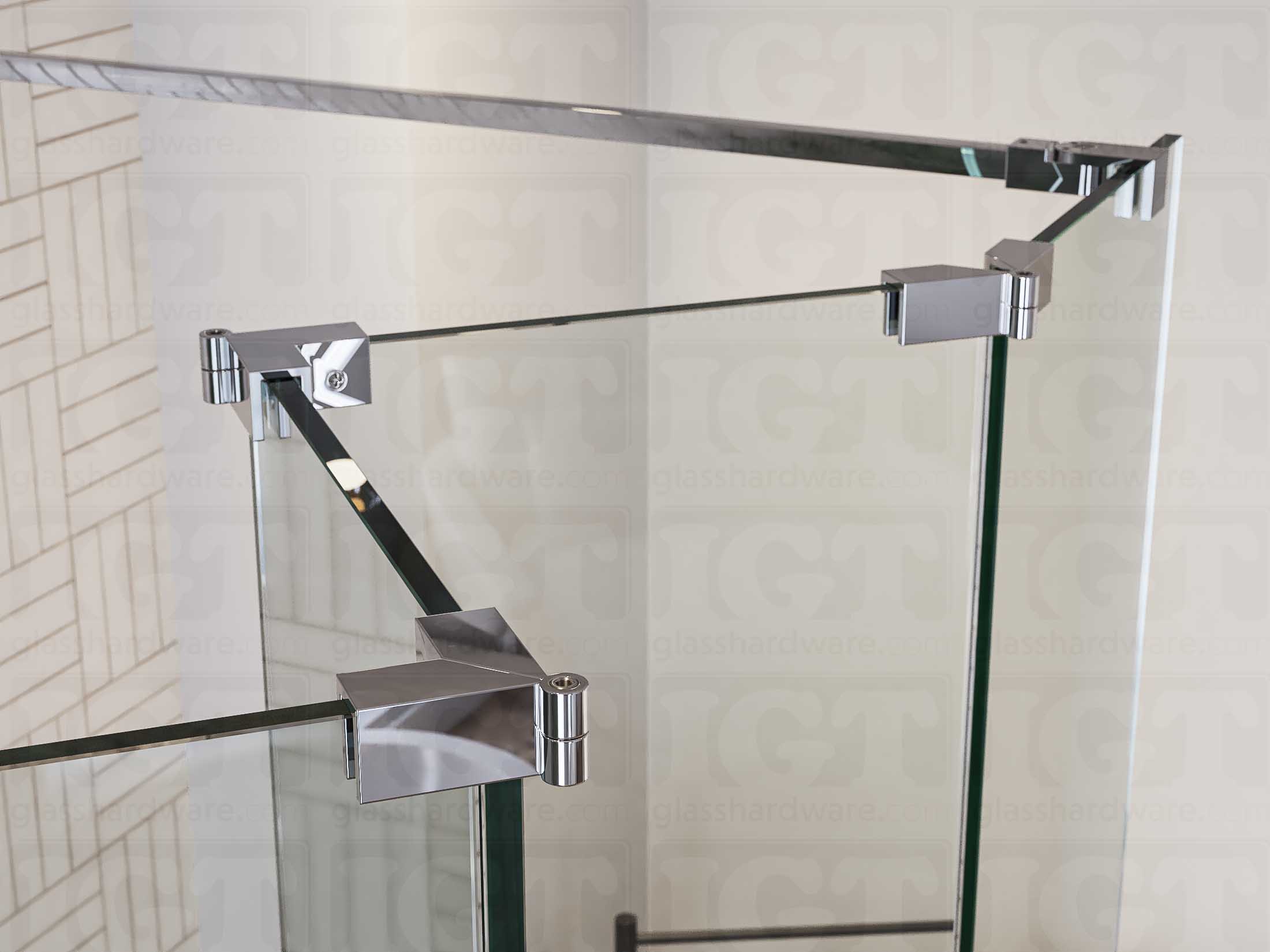 A close up of three Glass-to-Glass Adjustable Sleeve Over Clamps in Chrome Polished installed on a doorless glass shower enclosure alongside a matching support bar.