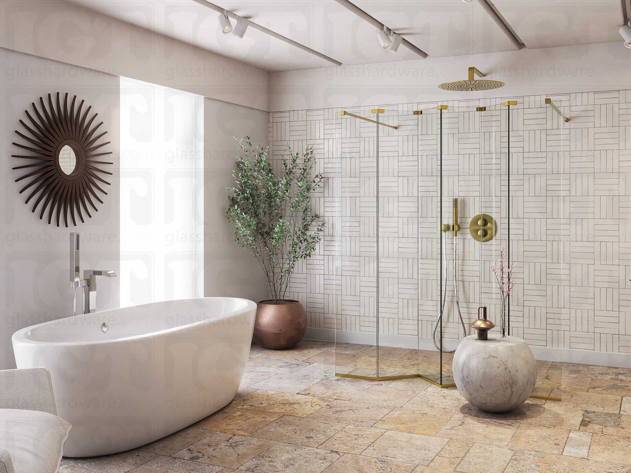 A modern bathroom featuring a doorless glass shower enclosure, using various Glass-to-Glass Adjustable Sleeve Over Clamps to hold the panels together. The image shows the bathrooms earthy design and minimalist furnishing. Gold Brushed.