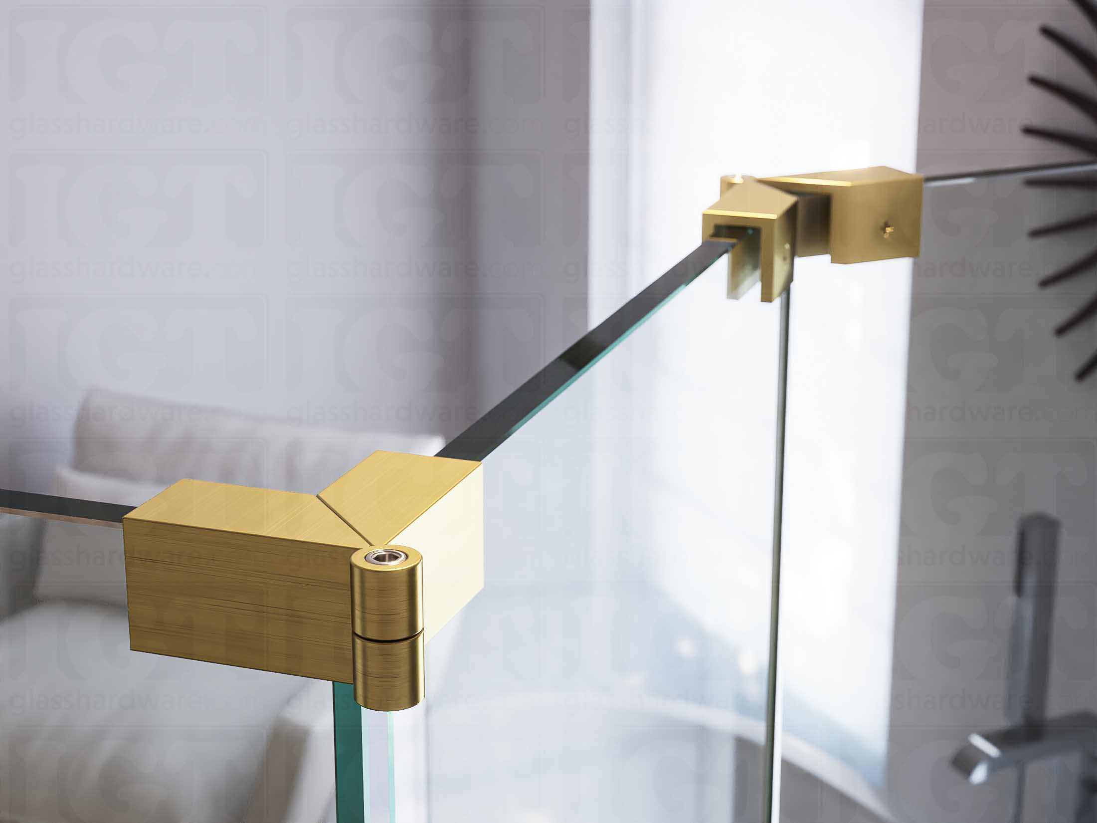 A close up of two Glass-to-Glass Adjustable Sleeve Over Clamps installed on a doorless glass shower enclosure. Gold Brushed.