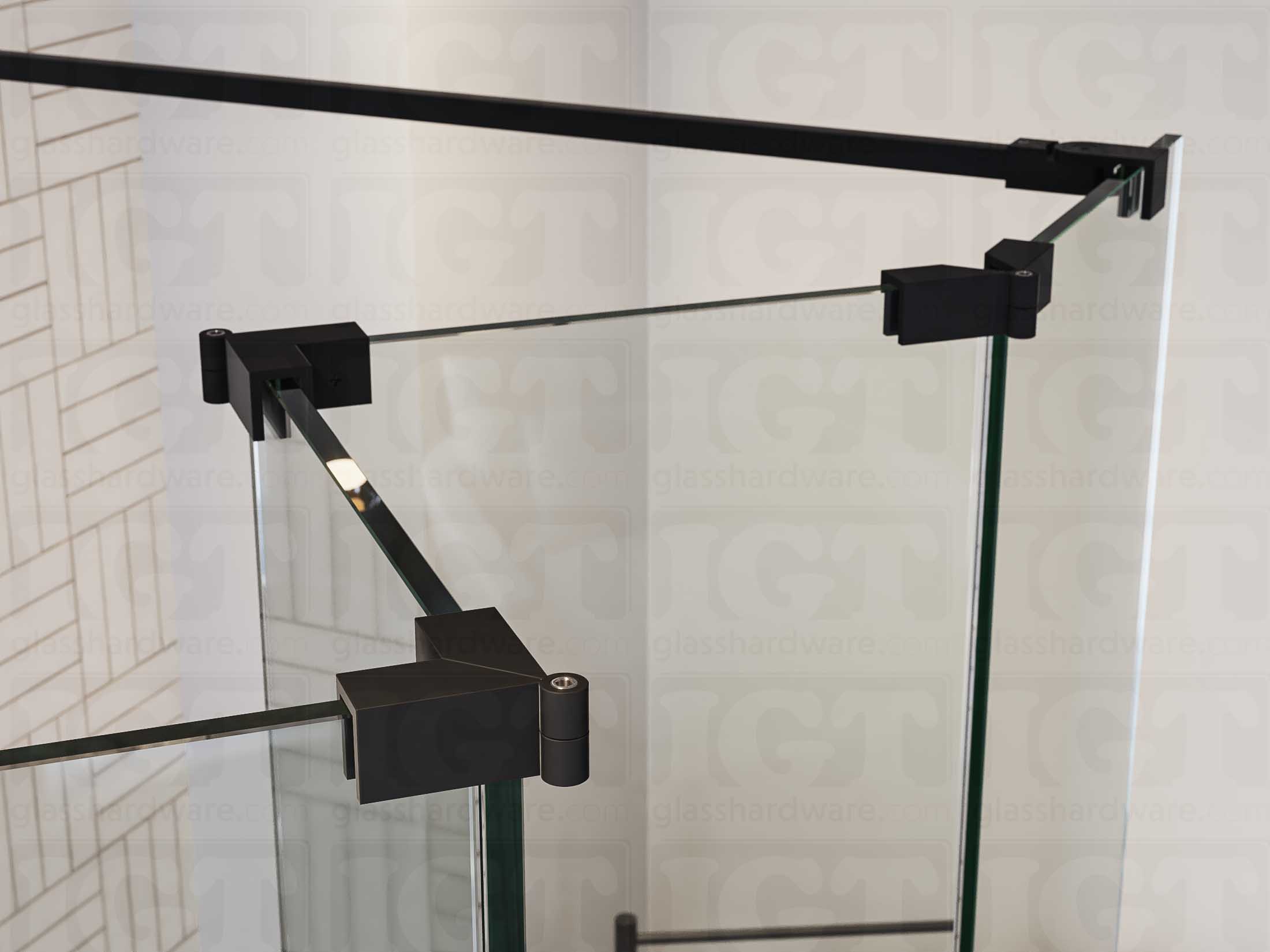 A close up of three Glass-to-Glass Adjustable Sleeve Over Clamps in Matte Black installed on a doorless glass shower enclosure alongside a matching support bar.