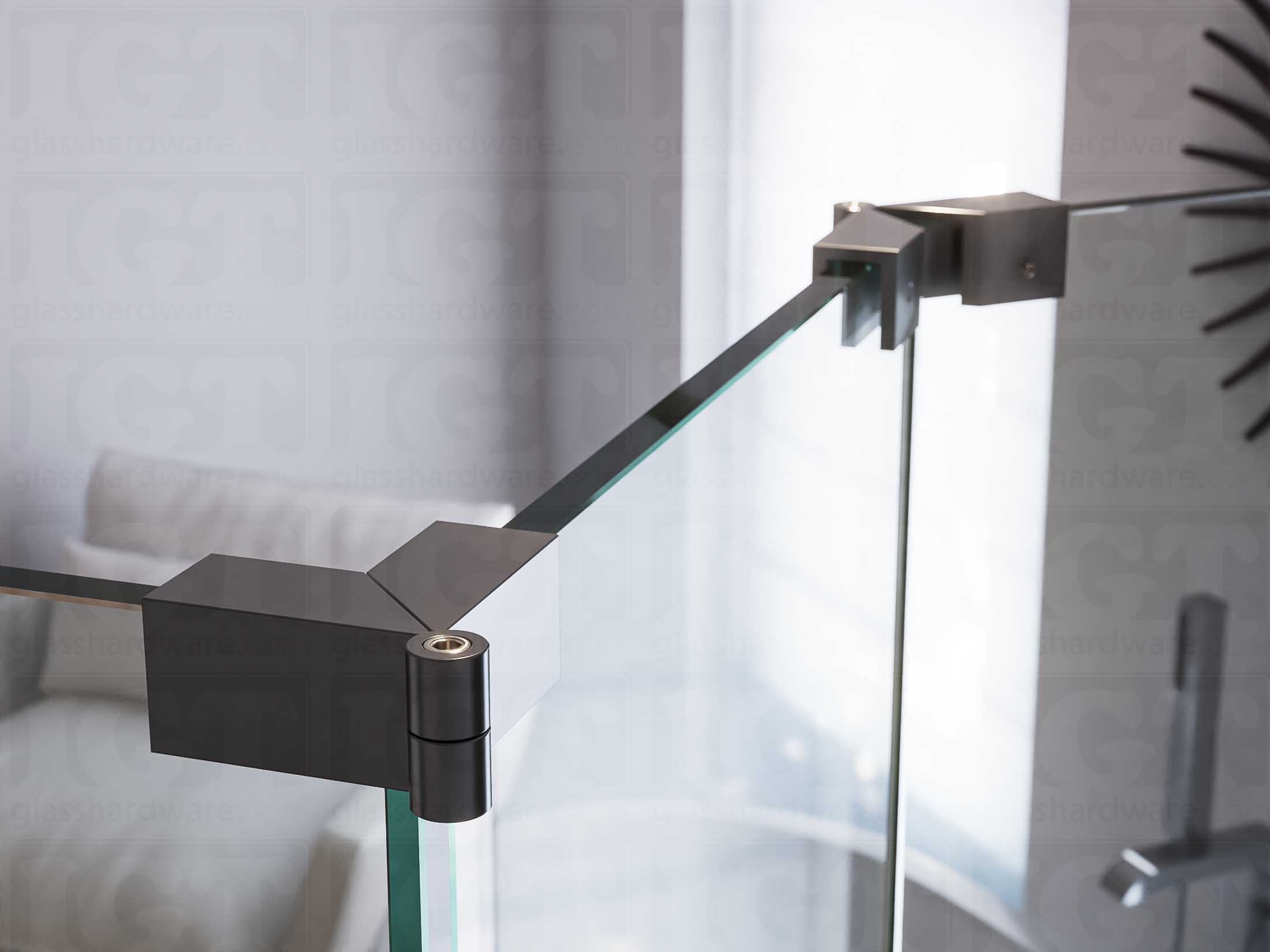 A close up of two Glass-to-Glass Adjustable Sleeve Over Clamps installed on a doorless glass shower enclosure. Polished Gun Metal.