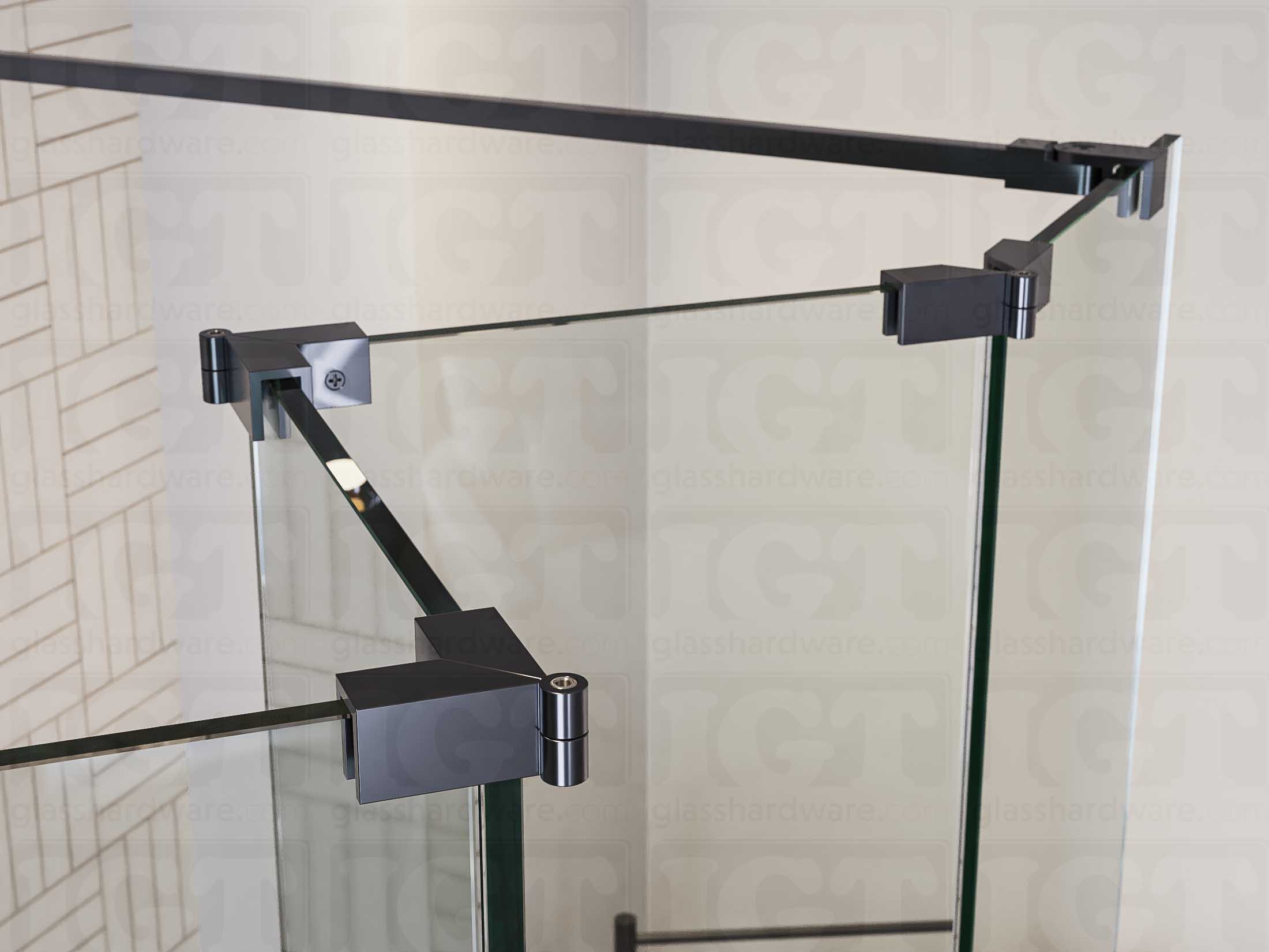 A close up of three Glass-to-Glass Adjustable Sleeve Over Clamps in Polished Gun Metal installed on a doorless glass shower enclosure alongside a matching support bar.