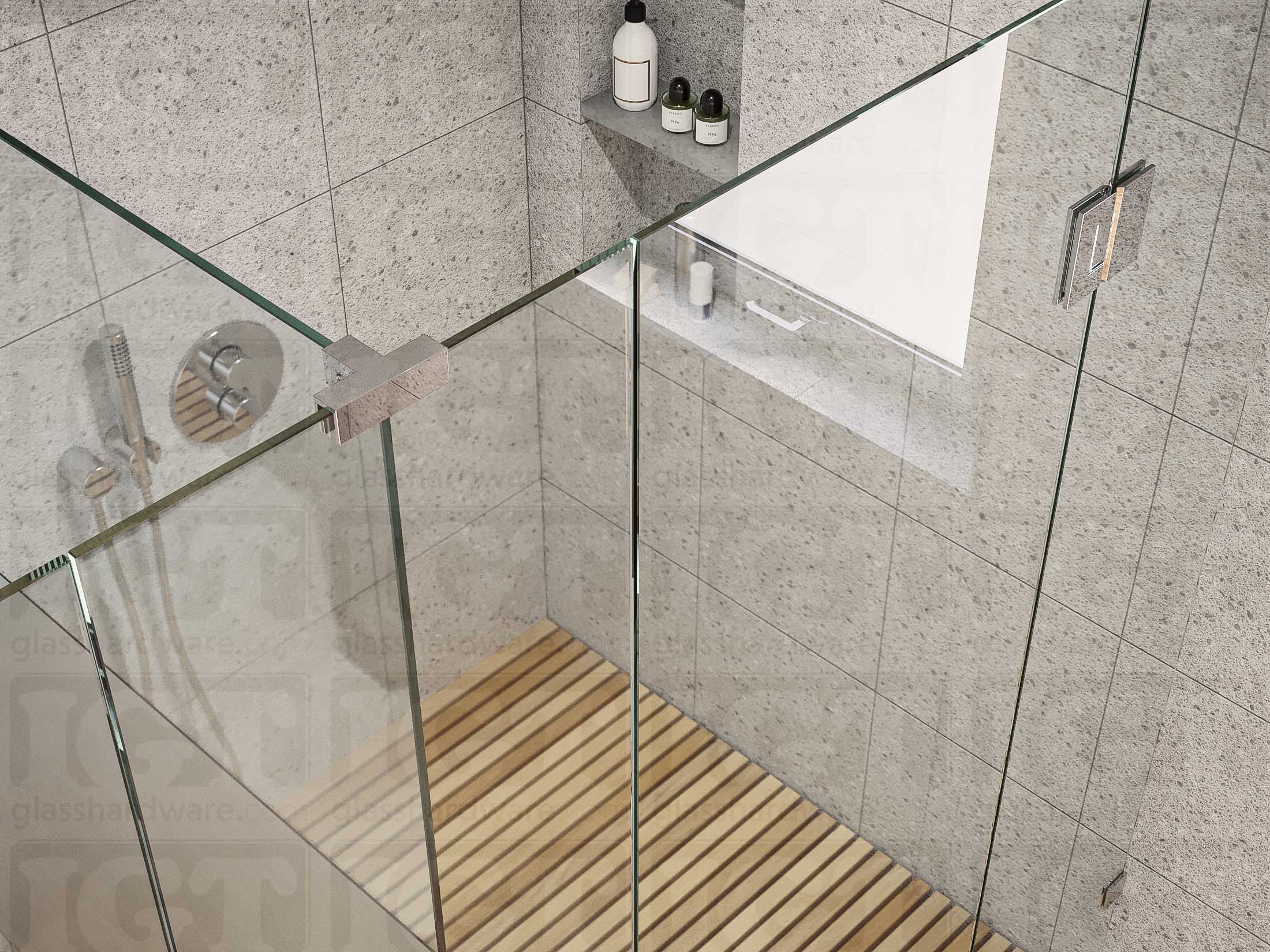 A top view of the T-shaped shower enclosure secured by a Glass-to-Glass T-Junction Sleeve Over Clamp. Its sleek design and Chrome Polished finish complements the shower's matching hinge and wall mounted clamp.