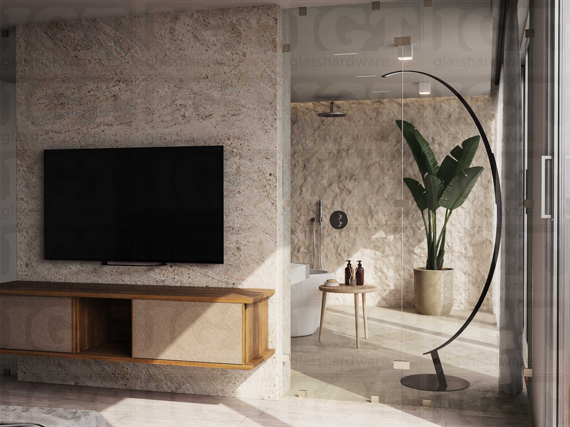 A closer view of the glass partition separating the bathoom from the bedroom. The installation features fixed panels held together by glass clamps, including two Square 180 Degree Glass-to-Glass Clamps (Full Plates) in Brushed Nickel.