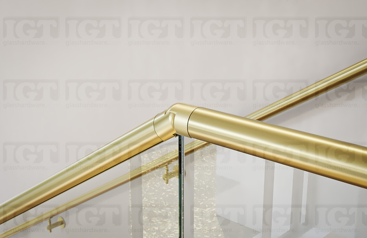 Another close-up of a joint in a stairway glass railing system using the 120" Round Cap Rail, Gold Brushed.