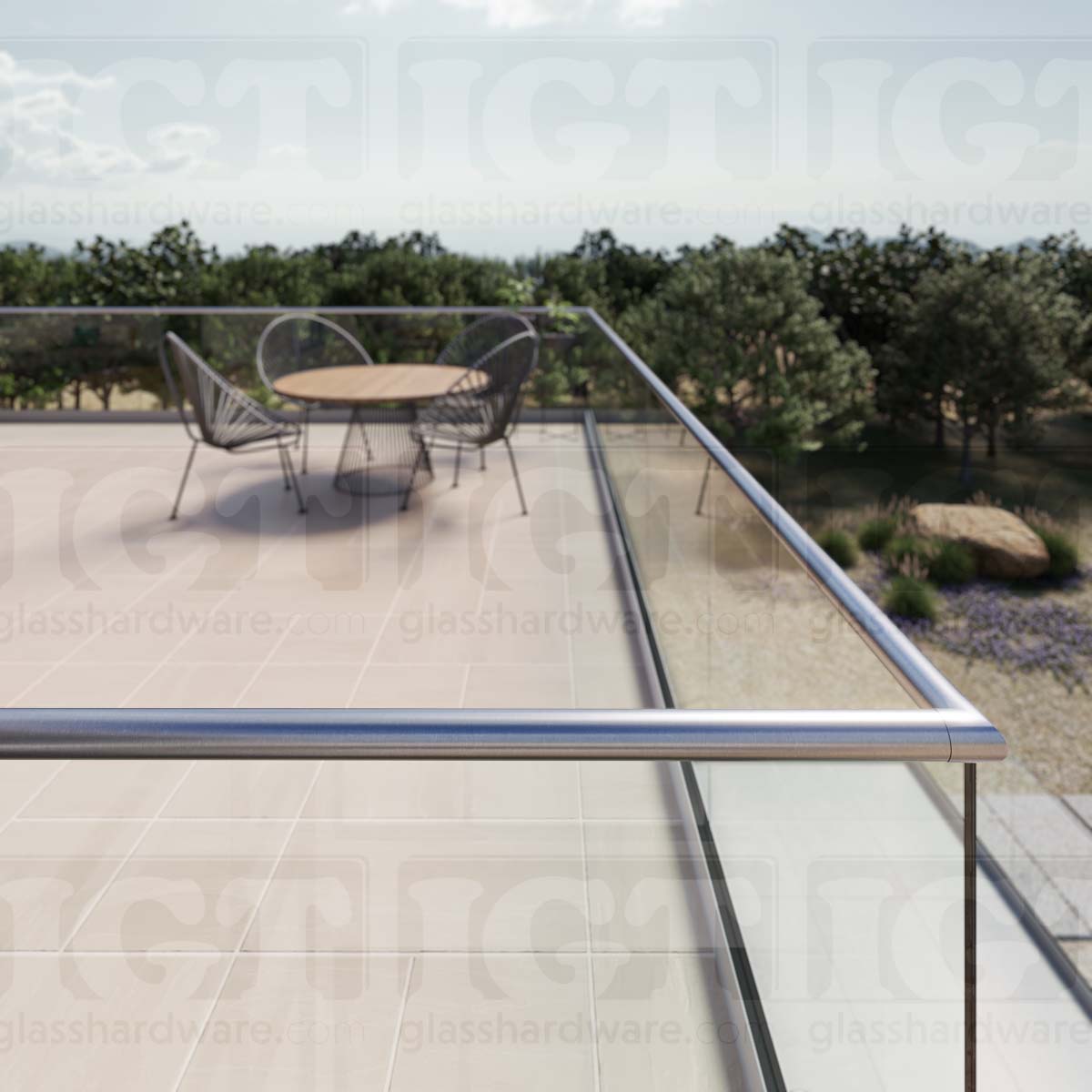 A close-up view of a corner joint in the terrace glass railing system, using the 220" Round Cap Rail, Brushed Stainless.