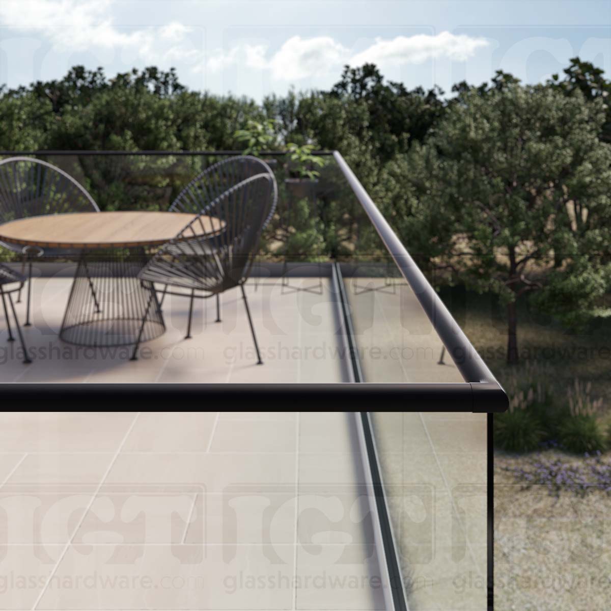 A close-up view of a corner joint in the terrace glass railing system, using the 220" Round Cap Rail, Matte Black.