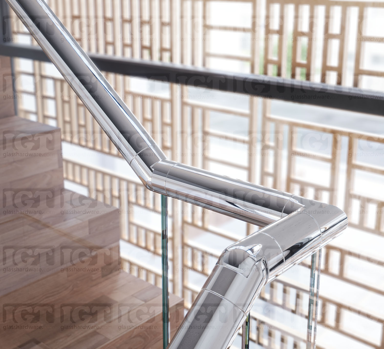 A close-up of a corner joint on a stairway glass railing system, featuring the 220" Round Cap Rail in Polished Stainless.