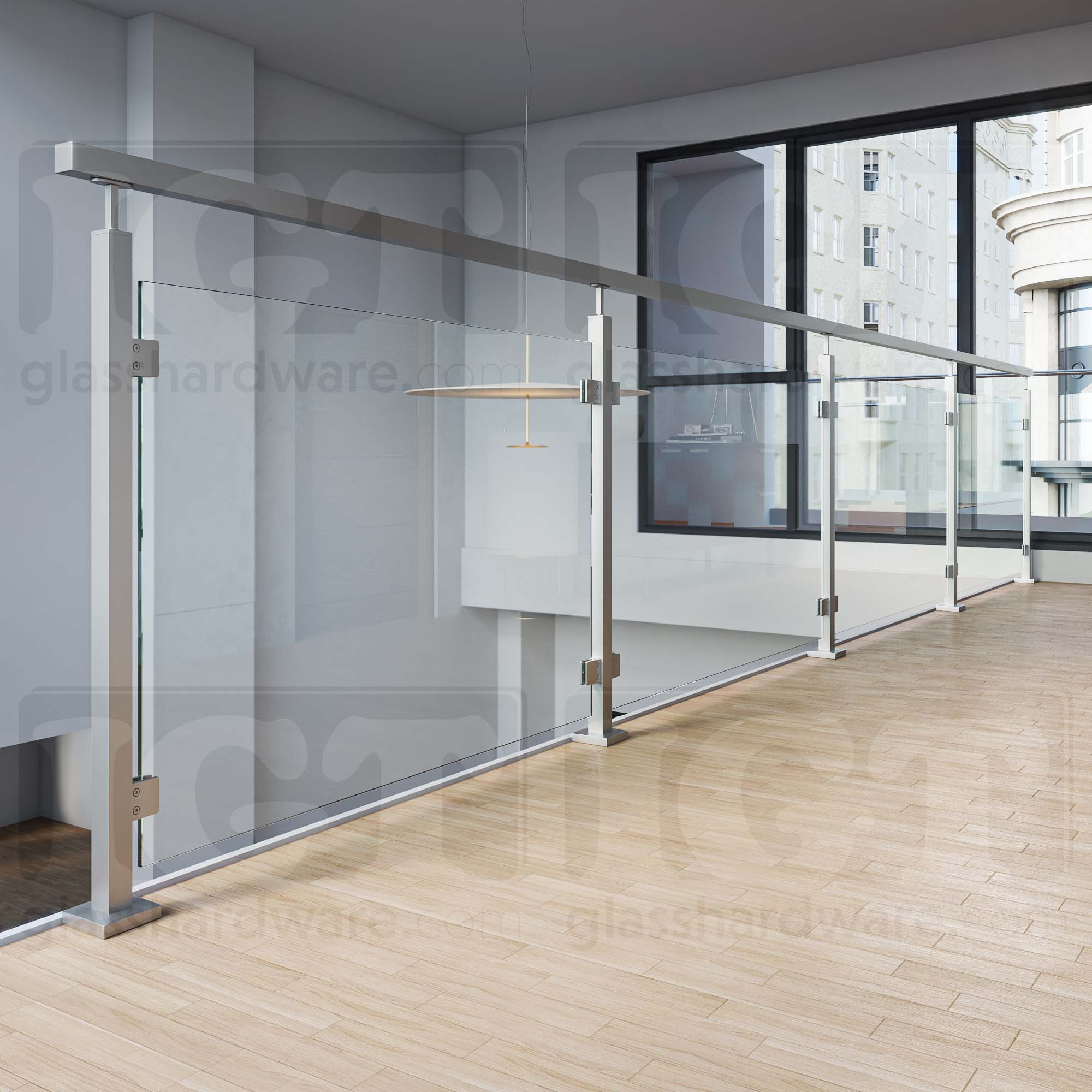 A glass railing system using the 120" Square Handrail, Brushed Stainless.