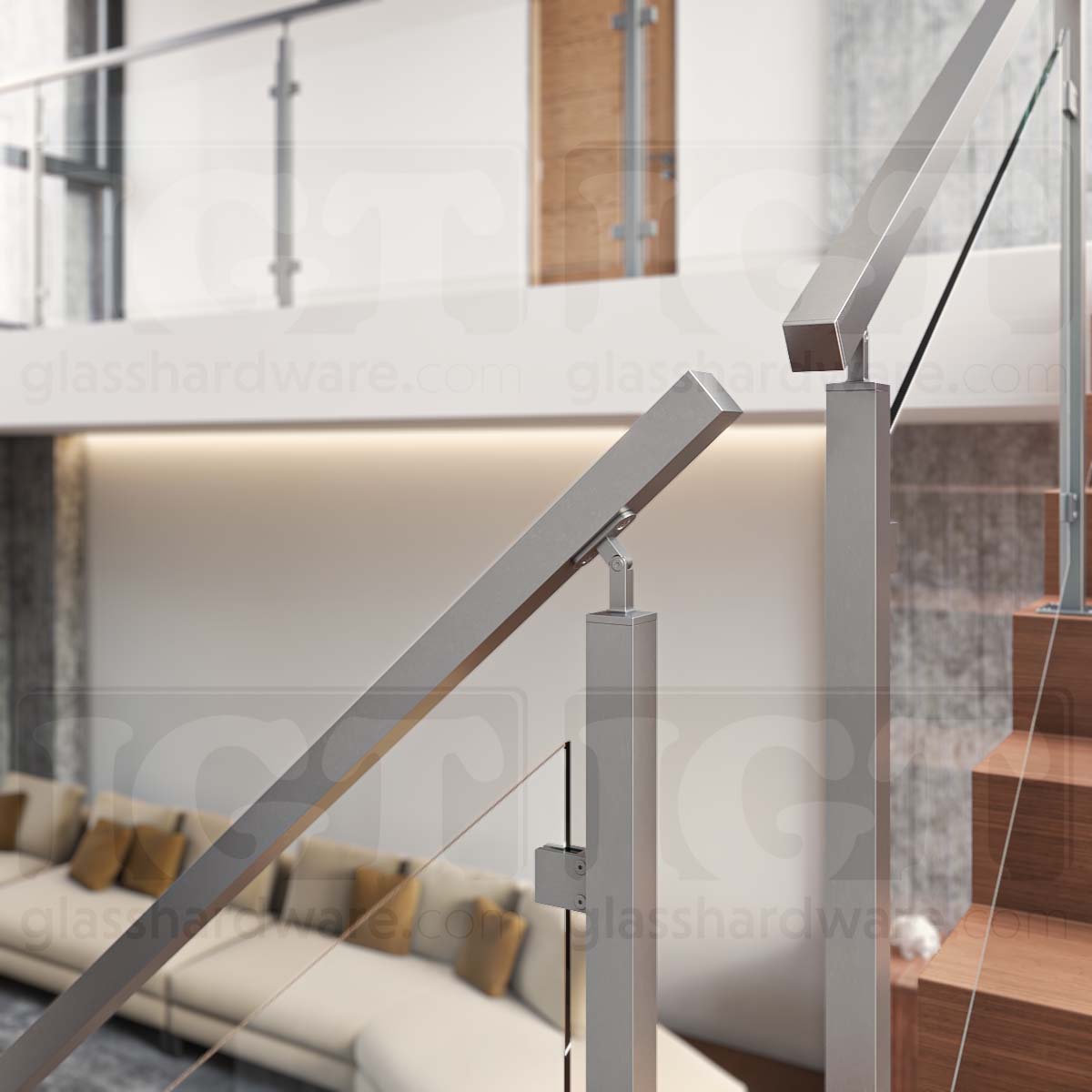 A close-view of a corner break in a stairway glass railing system using the 120" Square Handrail, Brushed Stainless.