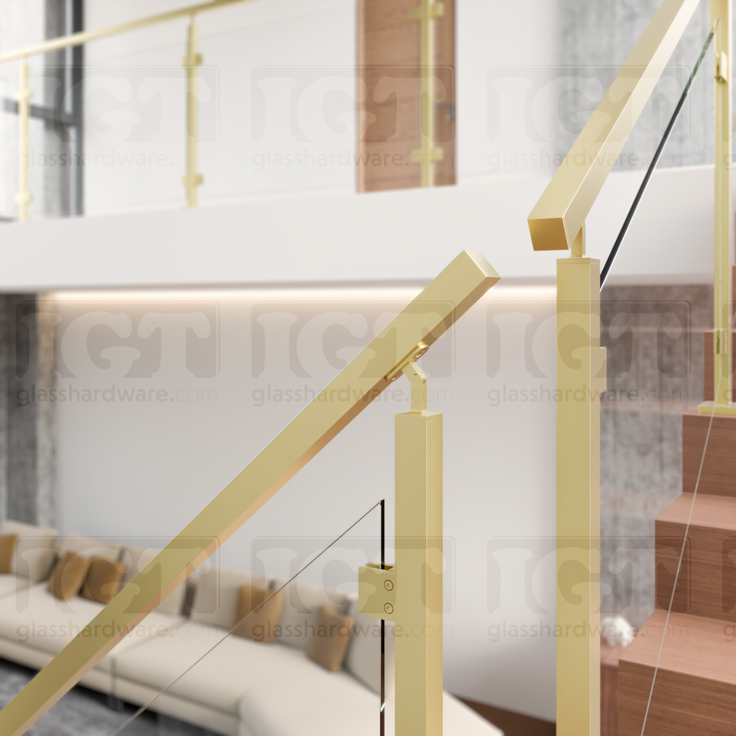 A close-view of a corner break in a stairway glass railing system using the 120" Square Handrail, Gold Brushed.