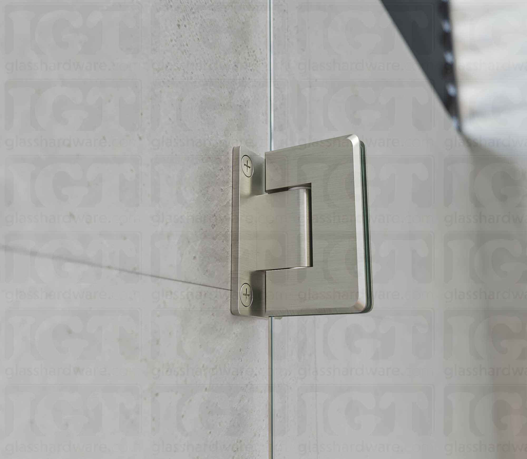 A close-up view of the Wall-to-Glass Full Back Bilboa Hinge installed on a modern shower door, showcasing its Brushed Nickel finish in more detail.