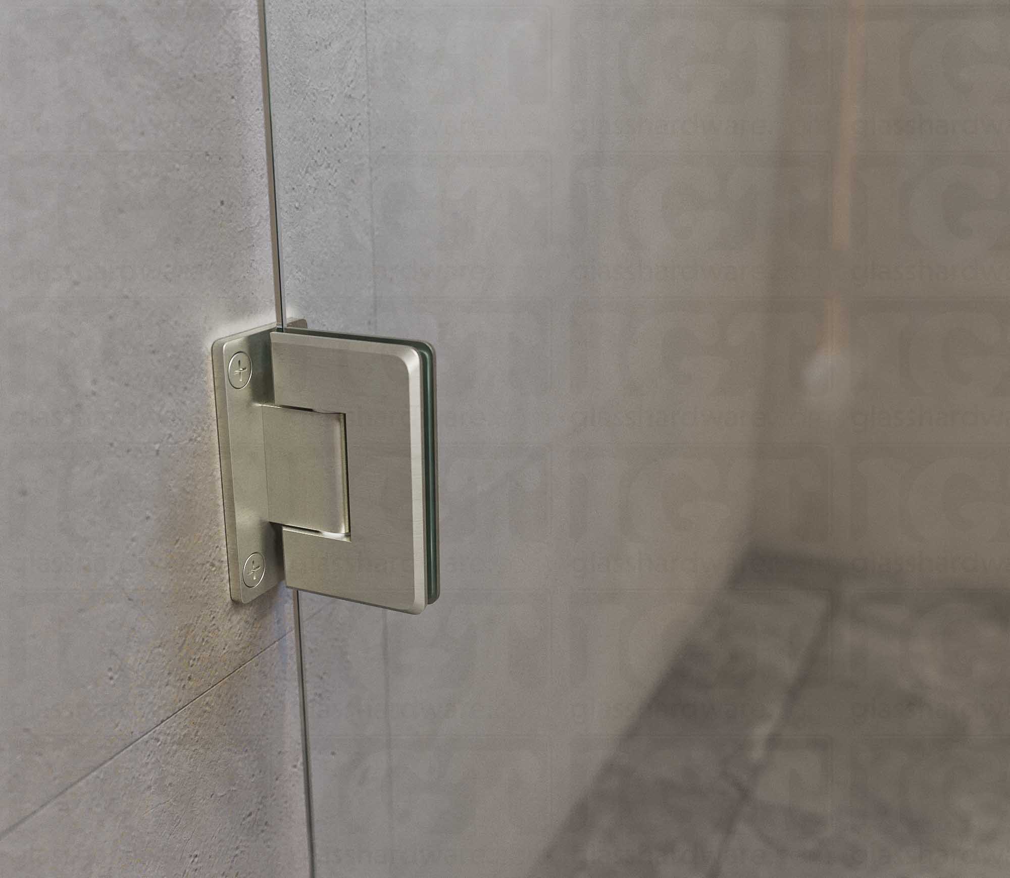 A close-up view of the Wall-to-Glass Full Back Bilboa Hinge used in a modern shower door installation, showcasing its Full Back Plate fixed to the wall. Brushed Nickel.