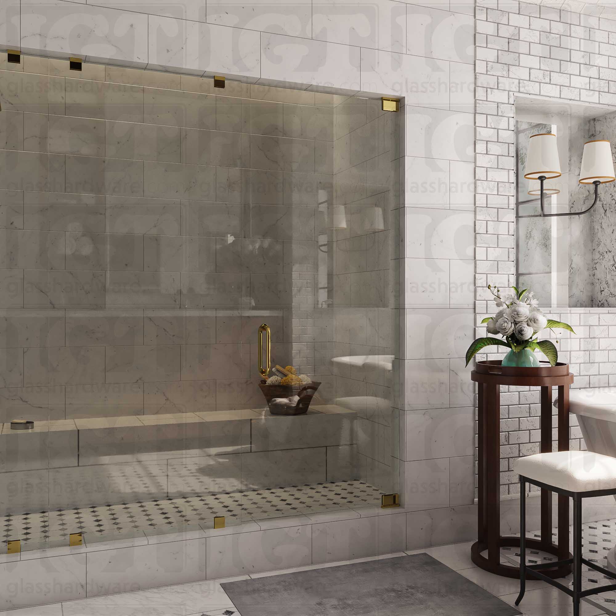 An elegant bathroom interior featuring a glass shower enclosure with two Top and Bottom Bilboa Pivot Hinges for the shower door. The space has a marble-tiled shower with a built-in bench. Soft, ambient lighting highlights the luxurious finishes, creating a warm and sophisticated atmosphere. Polished Brass.