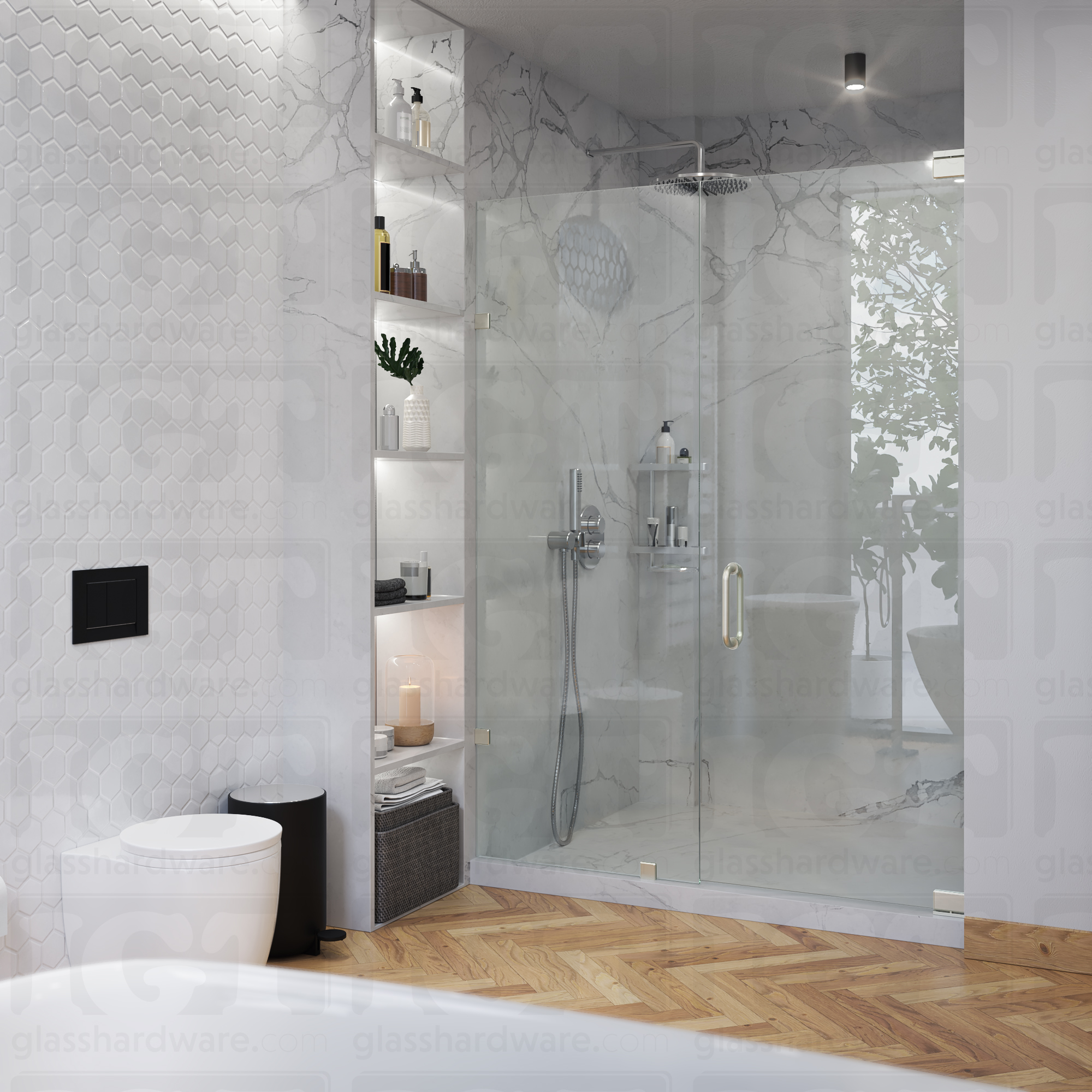 A modern bathroom featuring a frameless glass shower enclosure with a marble-patterned back wall. The shower door is secured by a bottom and a top pivot hinge, including the Left Wall Mount Bilboa Pivot Hinge mounted to the wall. The bathroom's clean design includes hexagonal wall tiles, built-in shelving for toiletries, and a warm wood herringbone floor, creating a luxurious and contemporary atmosphere. Brushed Nickel.