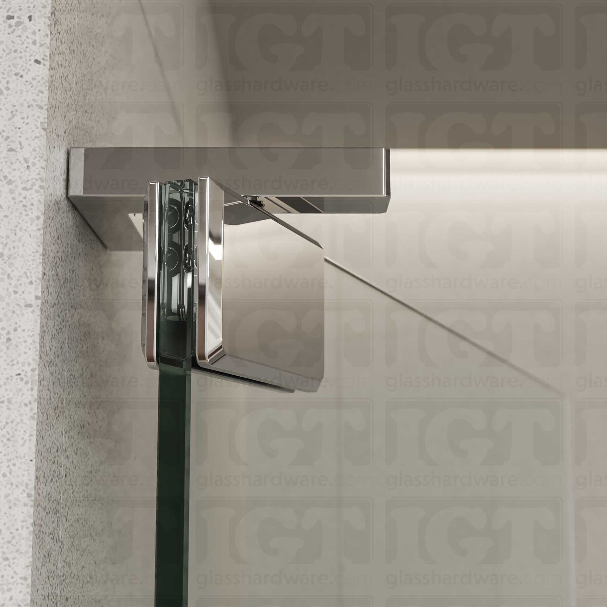 Close-up of the Right Wall Mount Bilboa Pivot Hinge mounted at the top of the glass shower door, in the open position. The hinge has soft rounded corners and sleek beveled edges, adding a touch elegance to the shower enclosure. Chrome Polished.