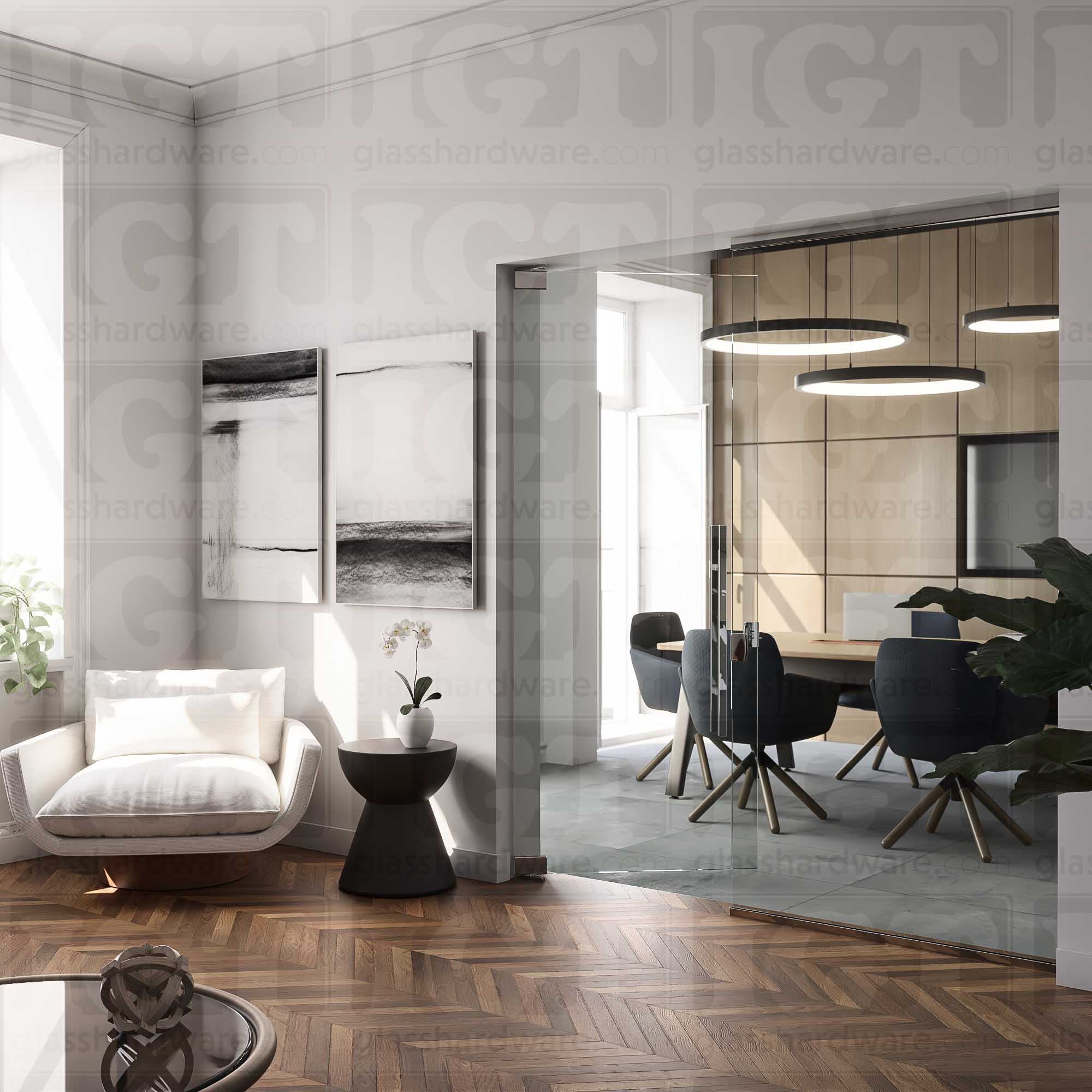 A modern interior view with a glass door seperating a cozy lounge area from a sleek conference room. The glass door is mounted with two Heavy Duty Top and Bottom Bilboa Pivot Hinges. Soft, natural lightning reflects off of the hinge's brass construction, while contrasting with the lounge's warm wood herringbone floor. Chrome Polished.