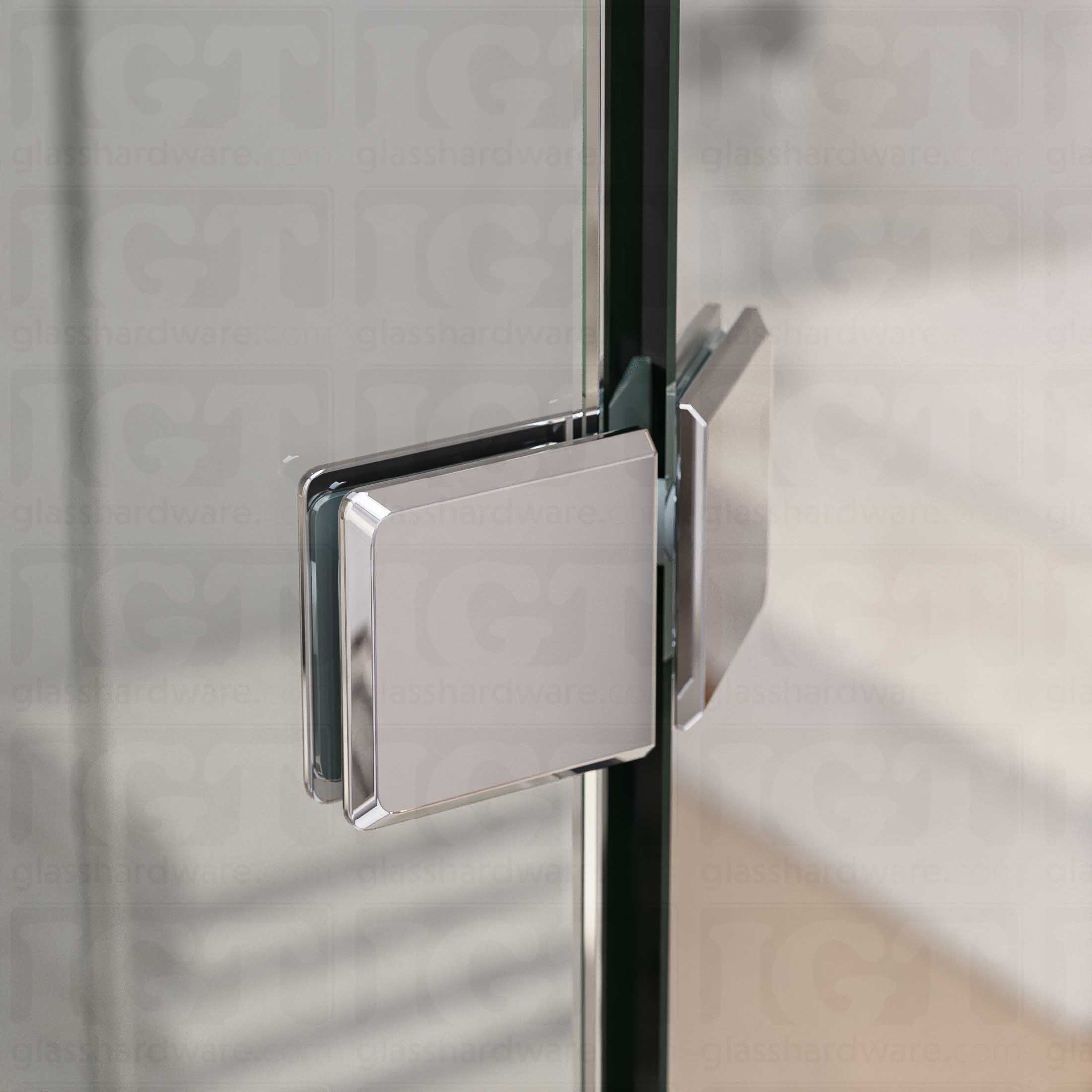 A close-up view of the Glass-to-Glass 135 Degree Bilboa Clamp, installed on a neo angle shower enclosure. The clamp's Solid Brass construction provides a secure and durable joint for the shower's angled panels. Chrome Polished.