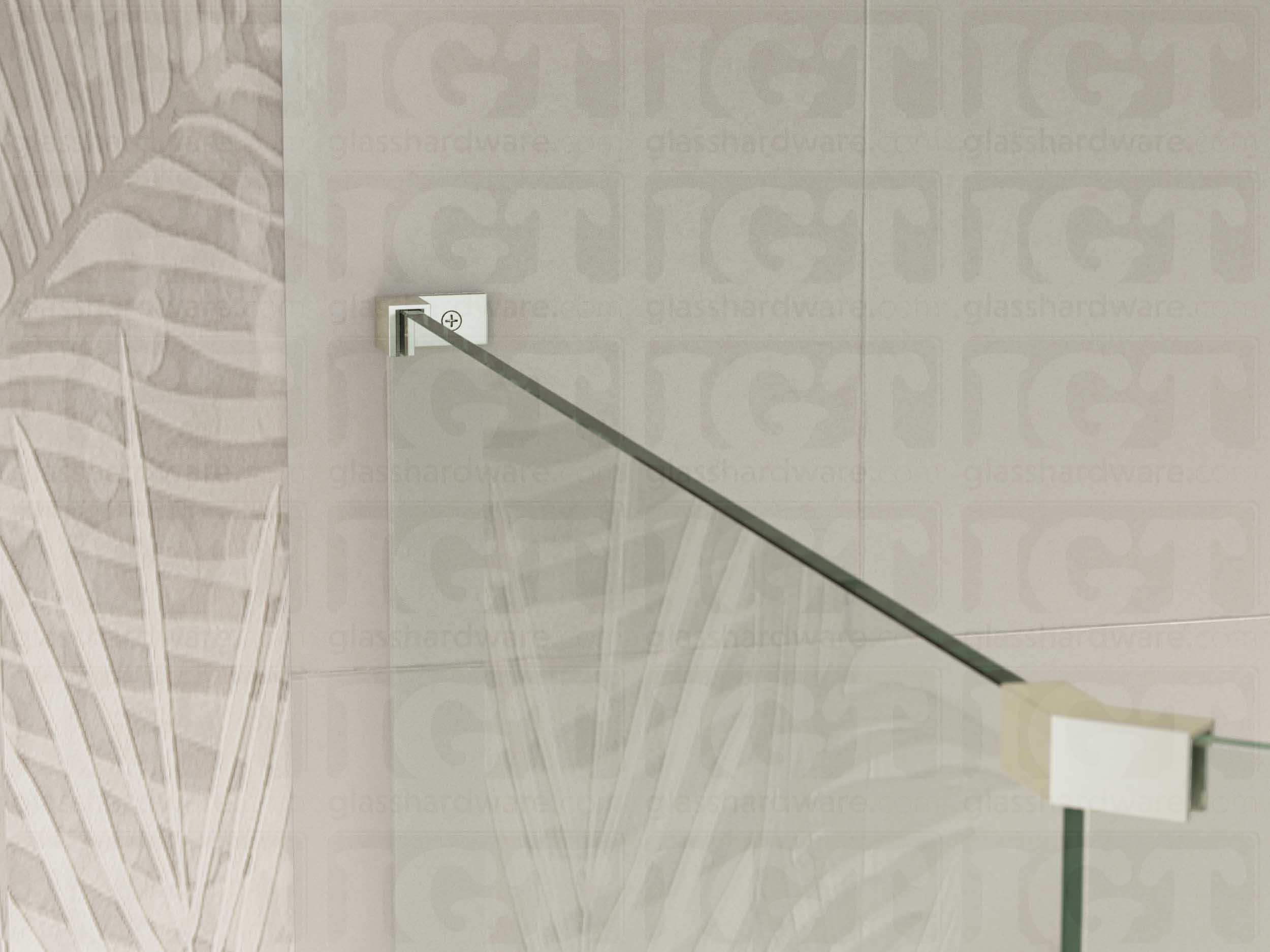 A view of the glass shower enclosure's upper section. The fixed panel is secured to the wall with a Left Wall-to-Glass Sleeve Over Clamp, and joined to an adjacent panel with a glass-to-glass clamp. Brushed Nickel.