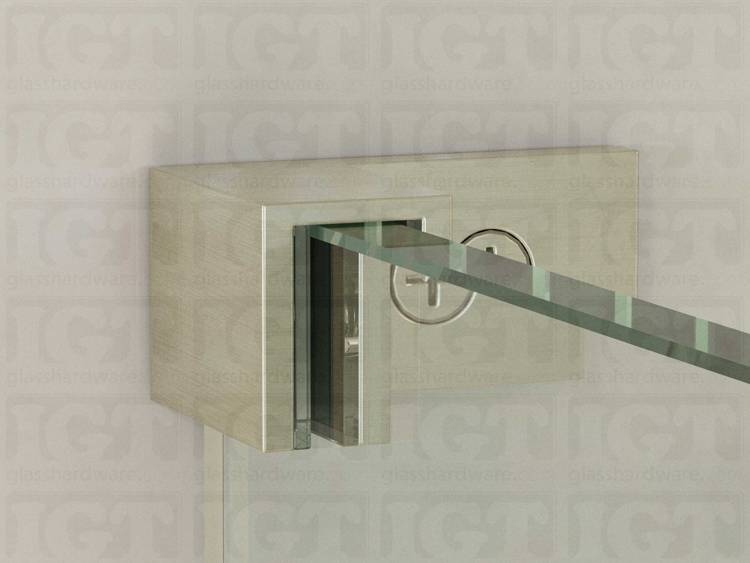 A close up of the Left Wall-to-Glass Sleeve Over Clamp mounted onto the glass panel. The glass is fitted securely into the clamps Solid Brass frame. Brushed Nickel.