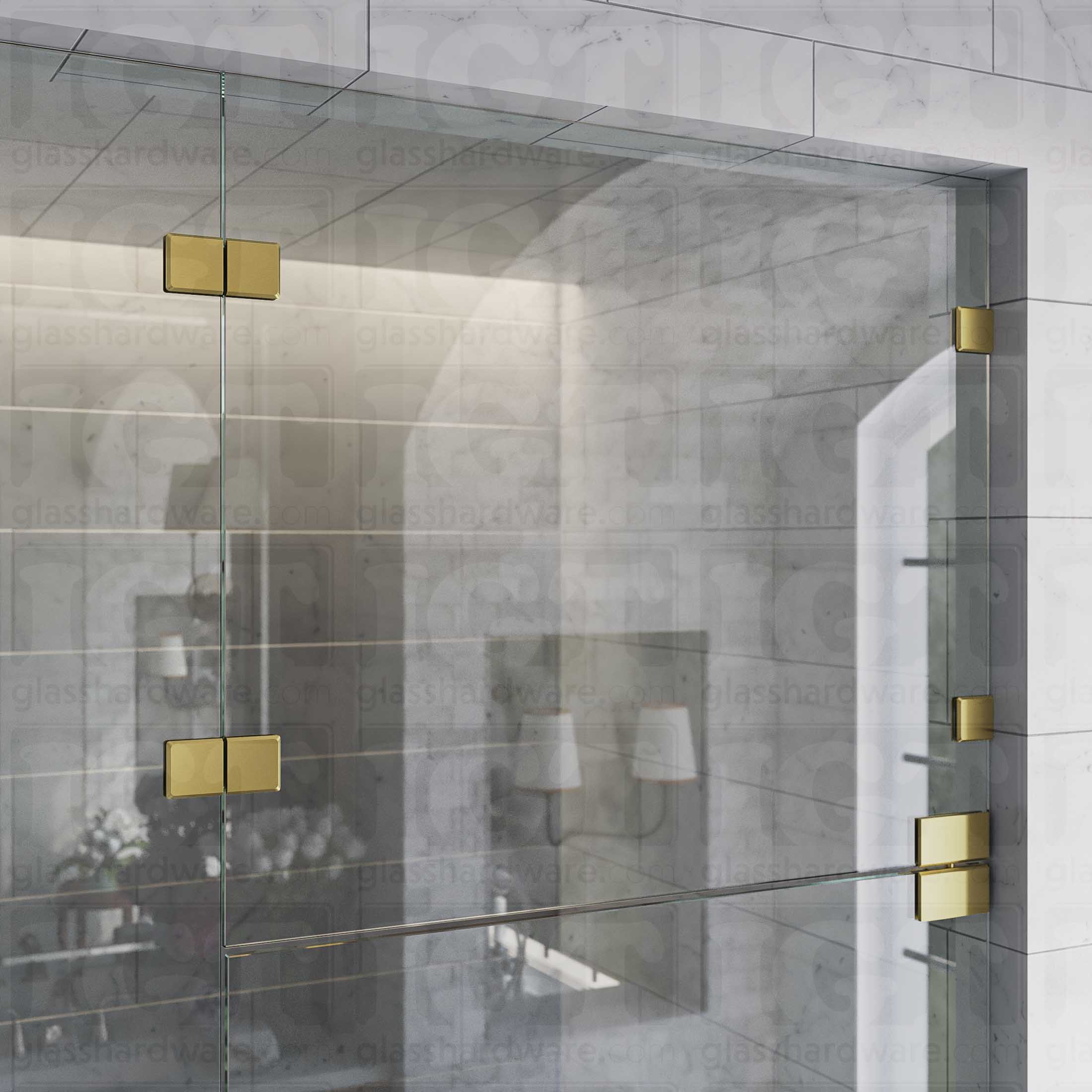 An upper view of the shower's glass panels, secured with Glass-to-Glass 180 Degree Bilboa Clamps (Split Face) alongside a matching hinge for the door. The hardware's corresponding finishes give the shower elegance and cohesiveness. Gold Brushed.