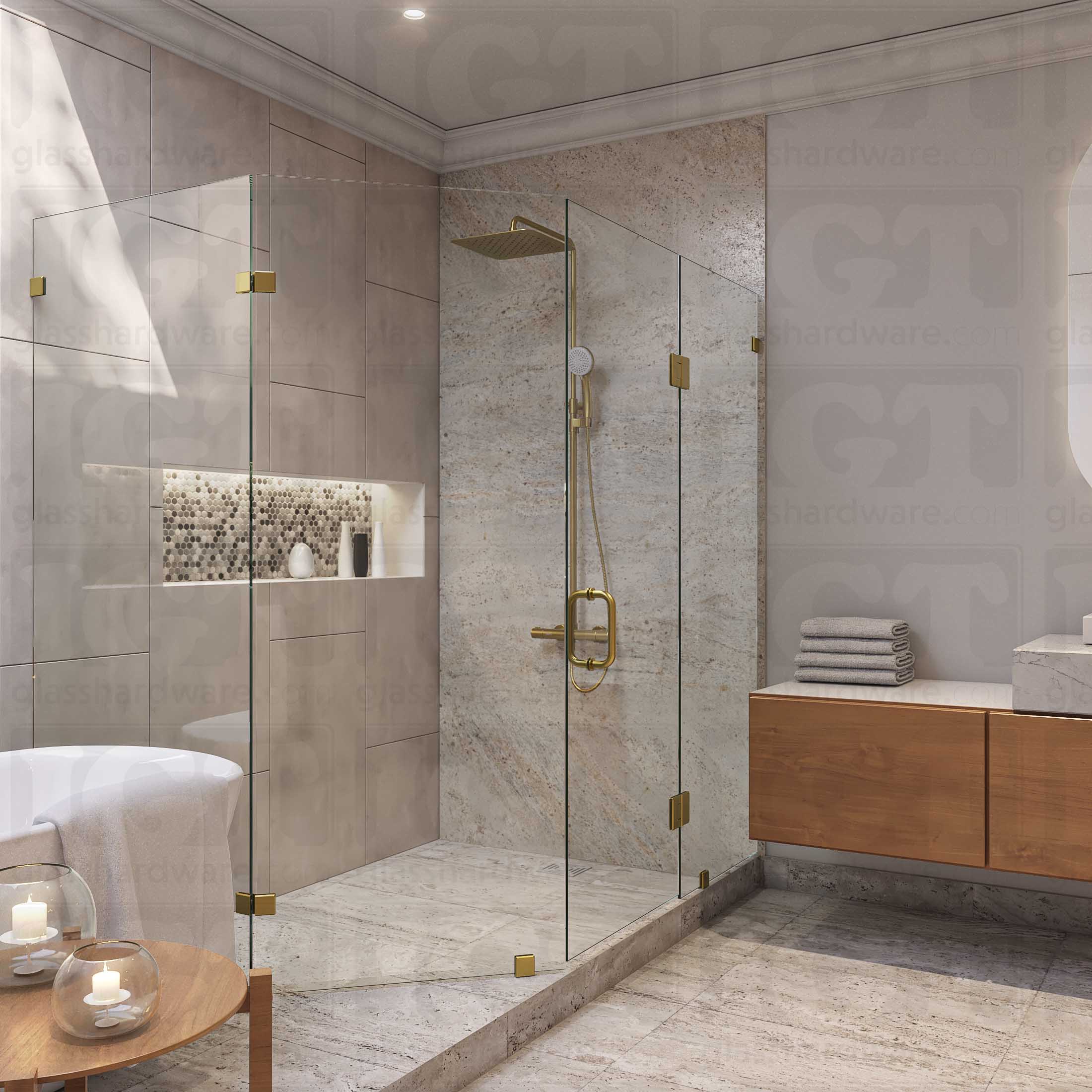 A modern bathroom featuring a frameless neo angle shower enclosure, secured by Glass-to-Glass 135 Degree Bilboa Clamps. The shower's frameless design complements the bathroom's overall earthy and minimalist aesthetic. Gold Brushed.