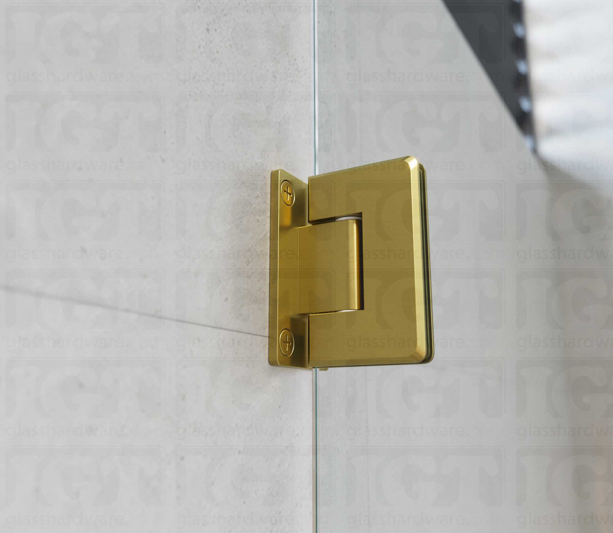 A close-up view of the Wall-to-Glass Full Back Bilboa Hinge installed on a modern shower door, showcasing its Gold Brushed finish in more detail.