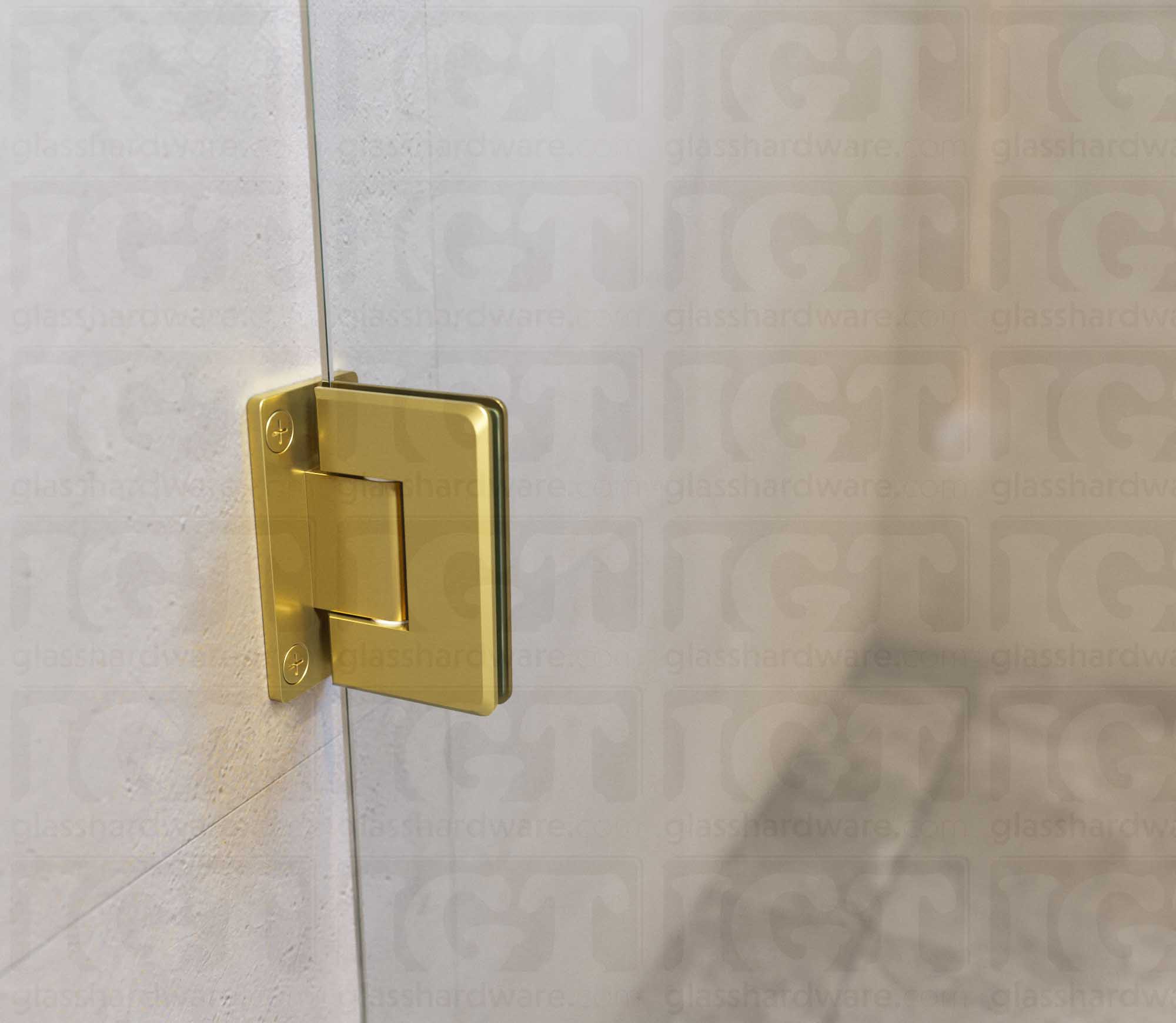 A close-up view of the Wall-to-Glass Full Back Bilboa Hinge used in a modern shower door installation, showcasing its Full Back Plate fixed to the wall. Gold Brushed.