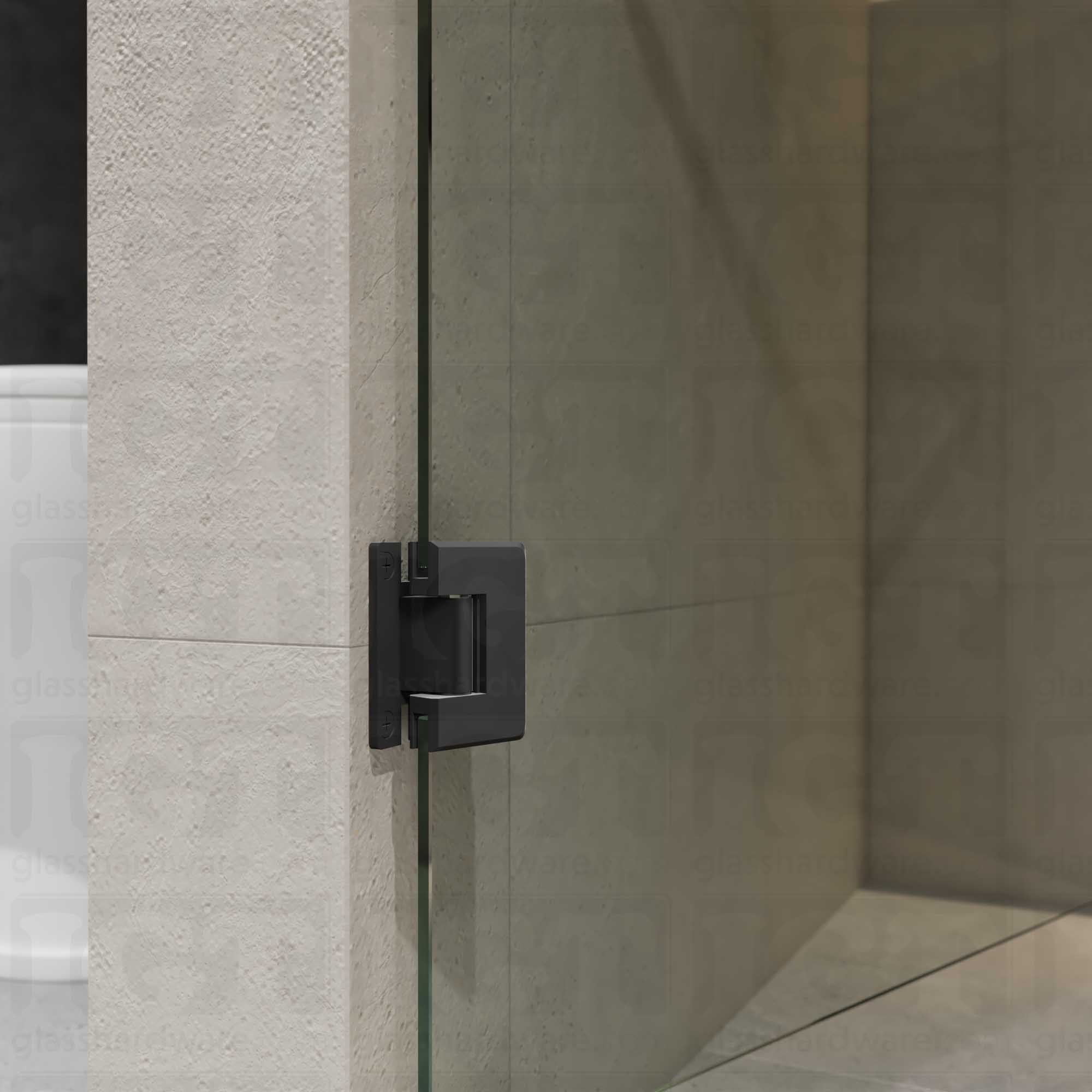 A close-up view of the Wall-to-Glass "H" Back Bilboa Hinge showcasing it's Matte Black finish in more detail.