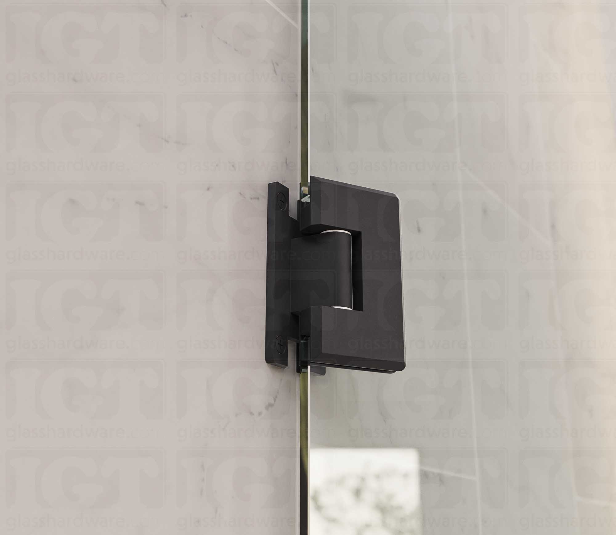 A close up view of the Heavy Duty Wall-to-Glass “H” Back Bilboa Hinge installed on a frameless glass shower door. Matte Black.