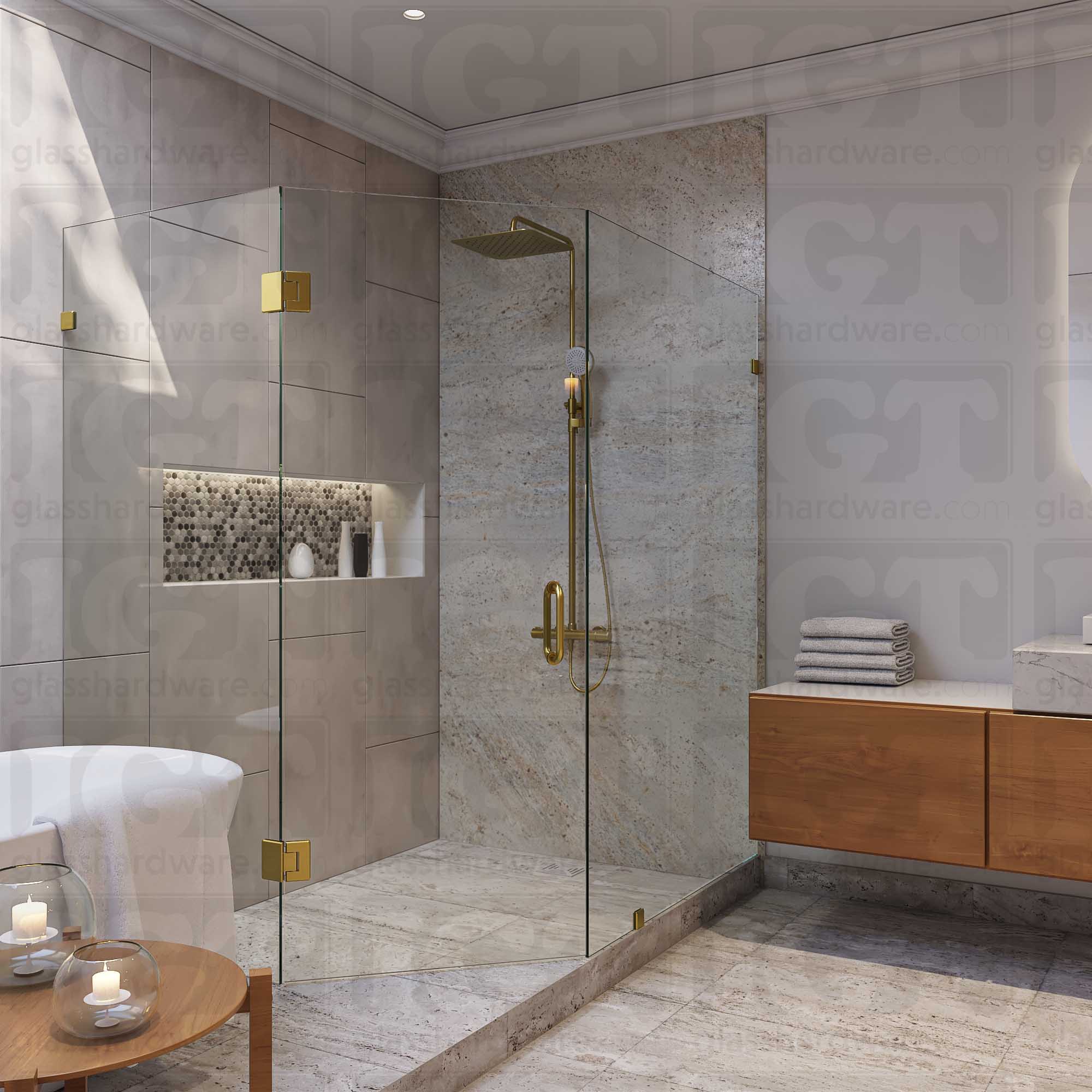 A modern frameless shower door installation using two Glass-to-Glass 135 Degree Bilboa Hinge. Gold Brushed.