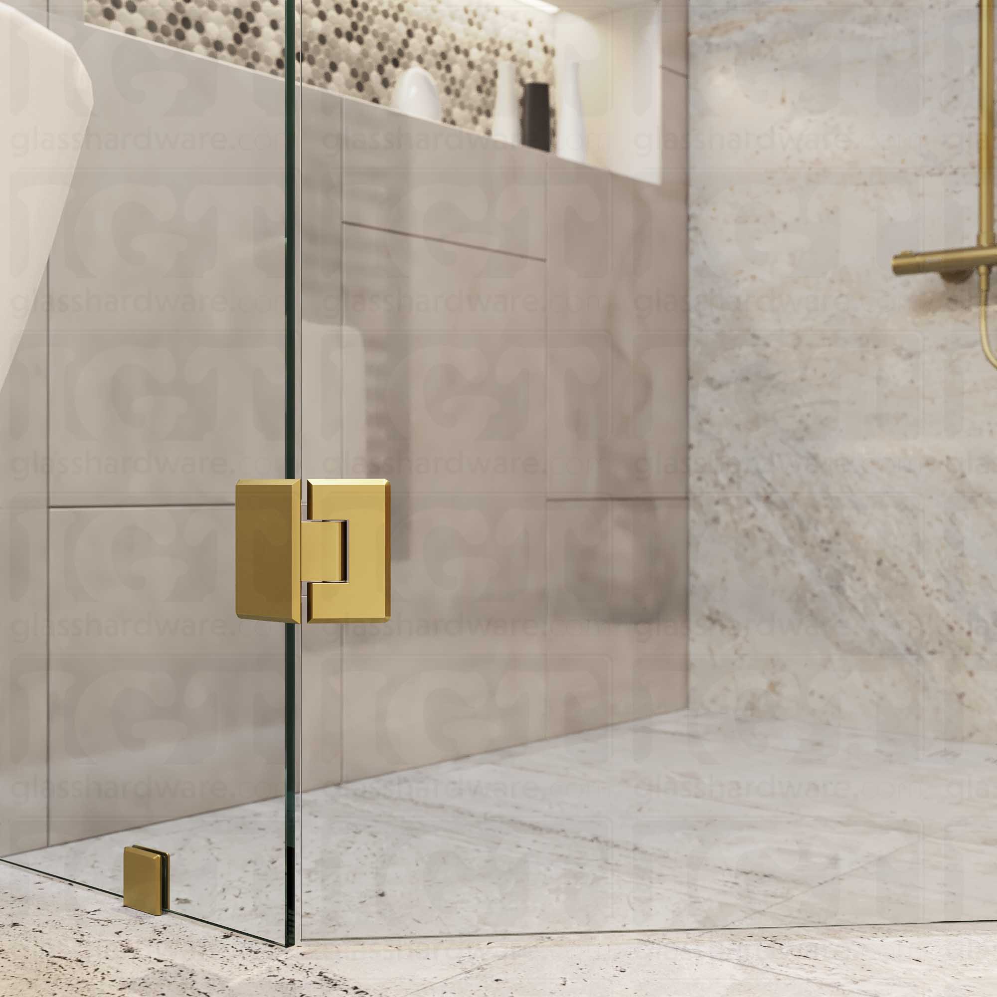 A close-up view of the bottom Heavy Duty Glass-to-Glass 135 Degree Bilboa Hinge installed on a neo angle shower door. Gold Brushed.