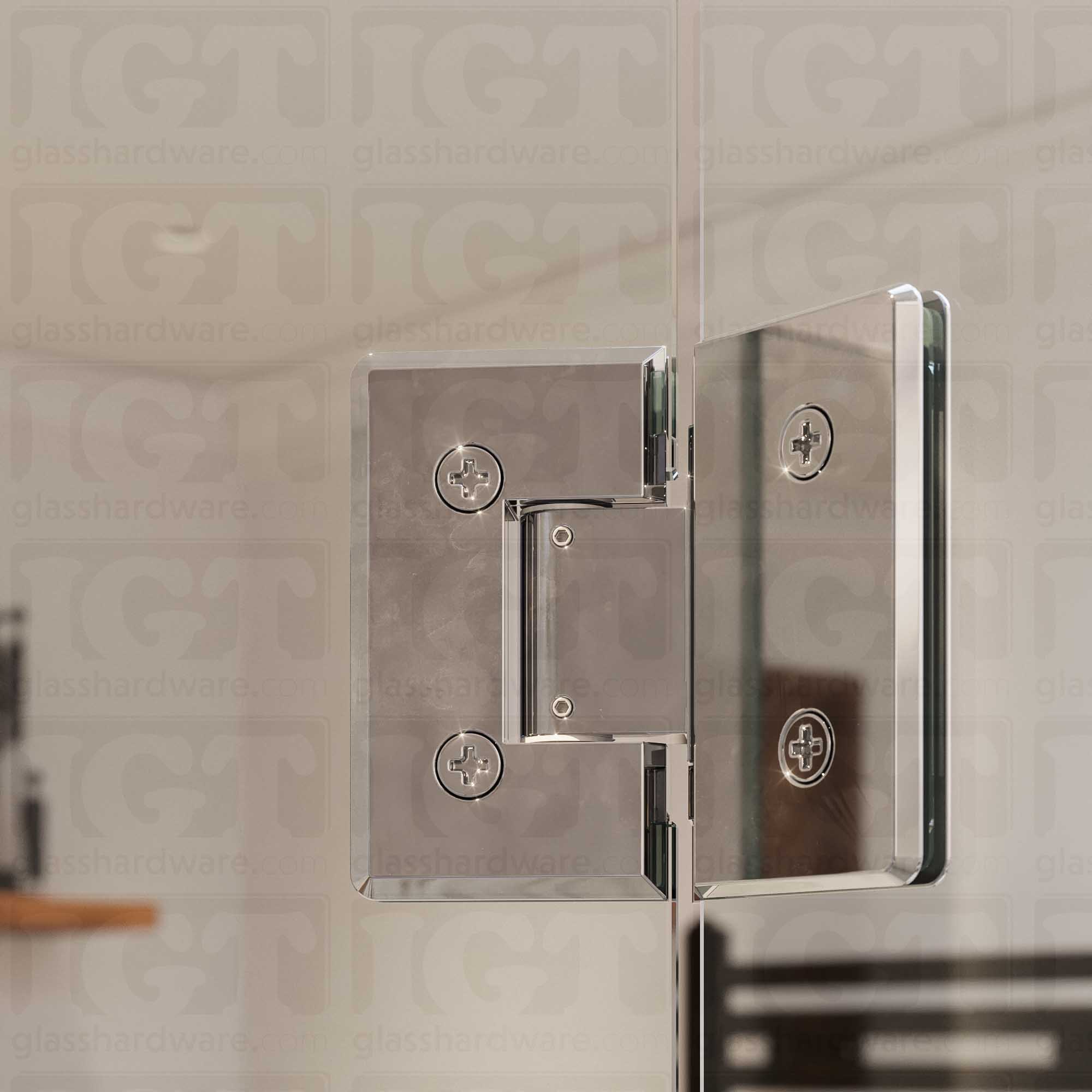 A close up view of the Heavy Duty Adjustable Glass-to-Glass 135 Degree Bilboa Hinge from inside the shower, showcasing it's sleek beveled edge design. Chrome Polished.