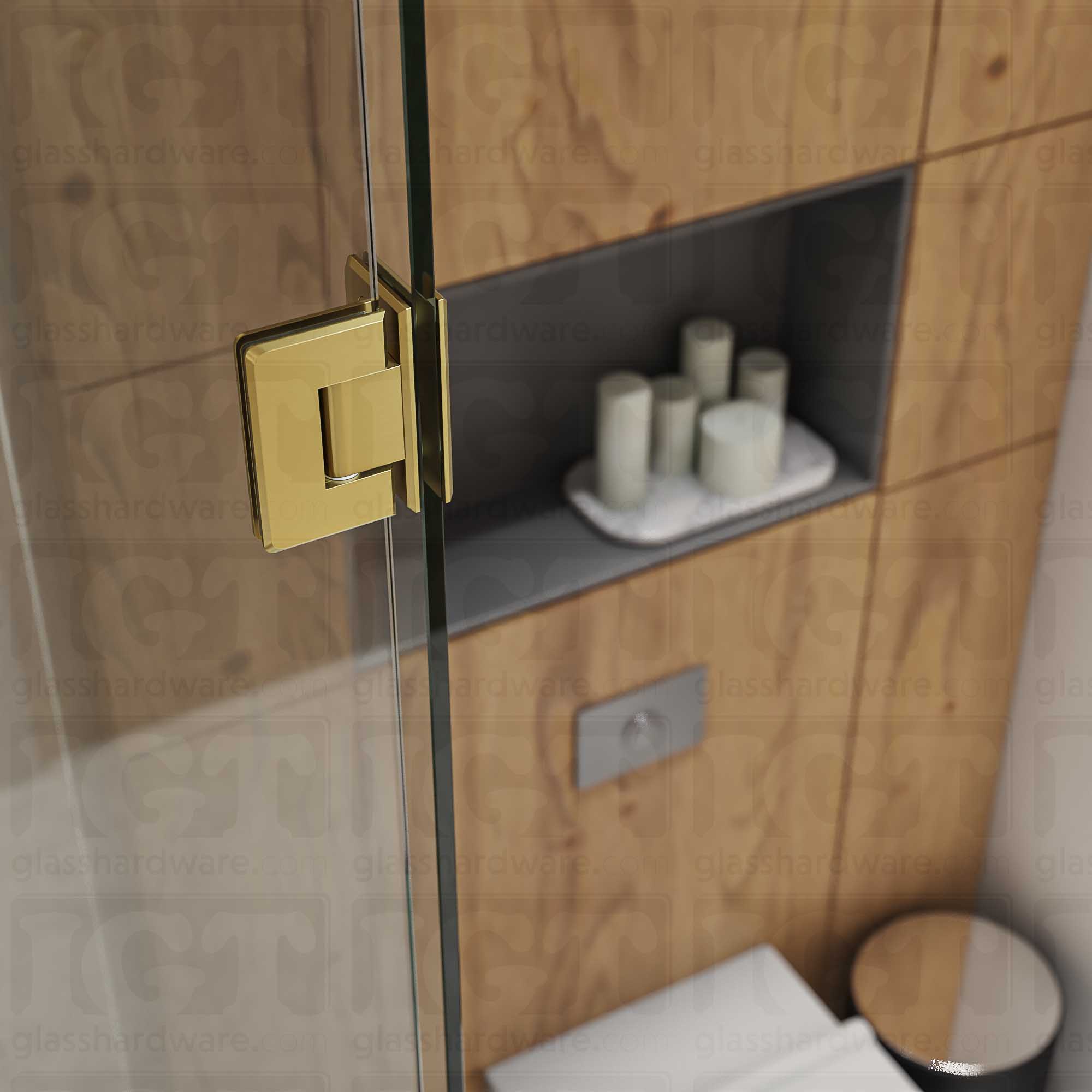 A close-up view of the Glass-to-Glass 90 Degree Bilboa Hinge installed on a modern shower door, showcasing its Gold Brushed finish in more detail.