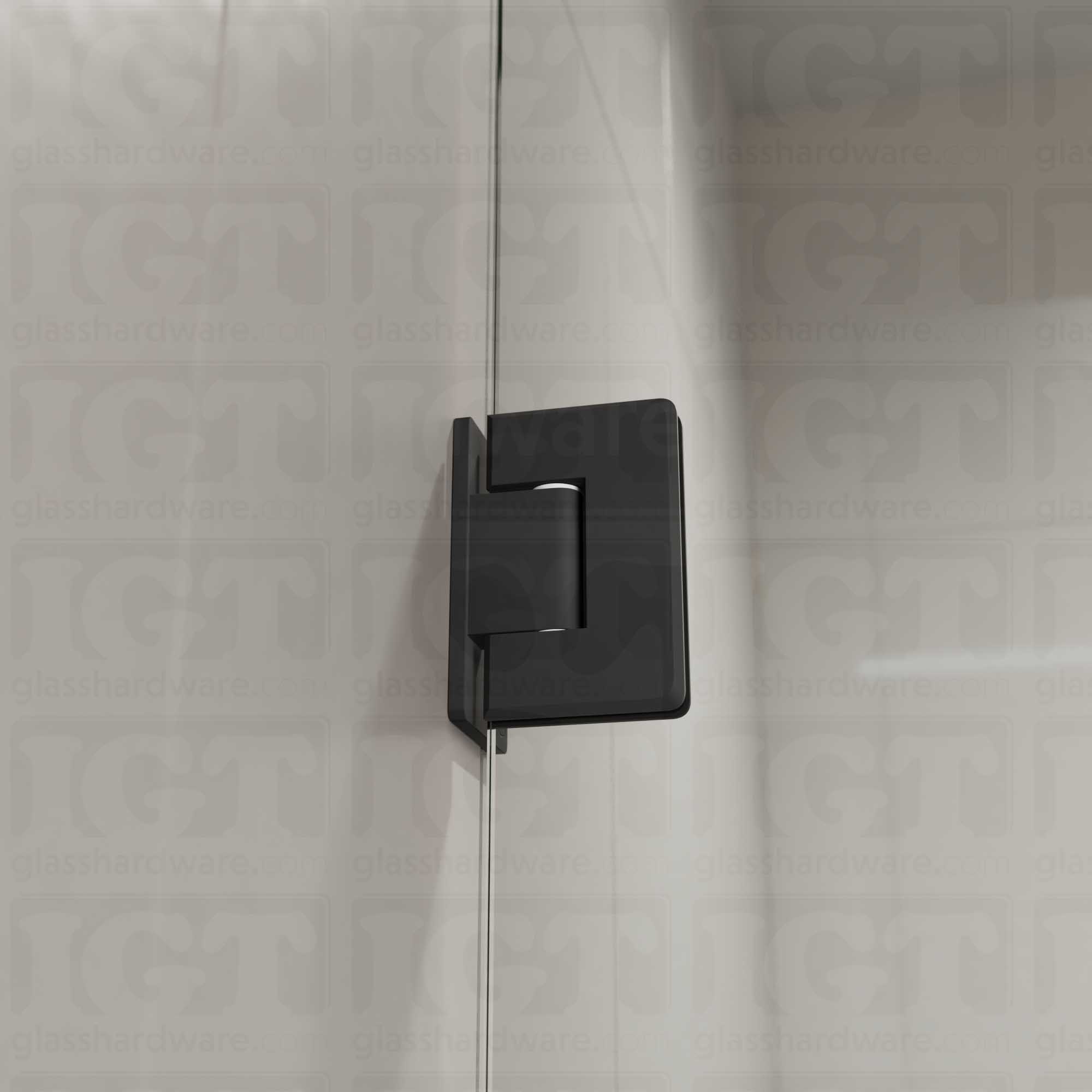 A close-up view of the Wall-to-Glass Offset Back Bilboa Hinge installed on a modern shower door, showcasing it's rounded corners and beveled edges. Matte Black.