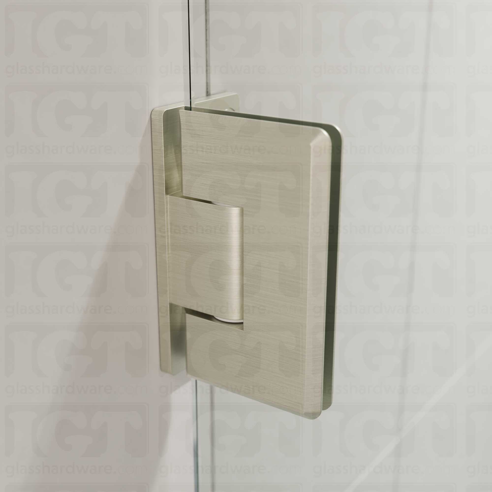 A close-up view of the Heavy Duty Wall-to-Glass Offset Back Bilboa Hinge installed on a modern shower door, showcasing its Brushed Nickel finish in more detail.