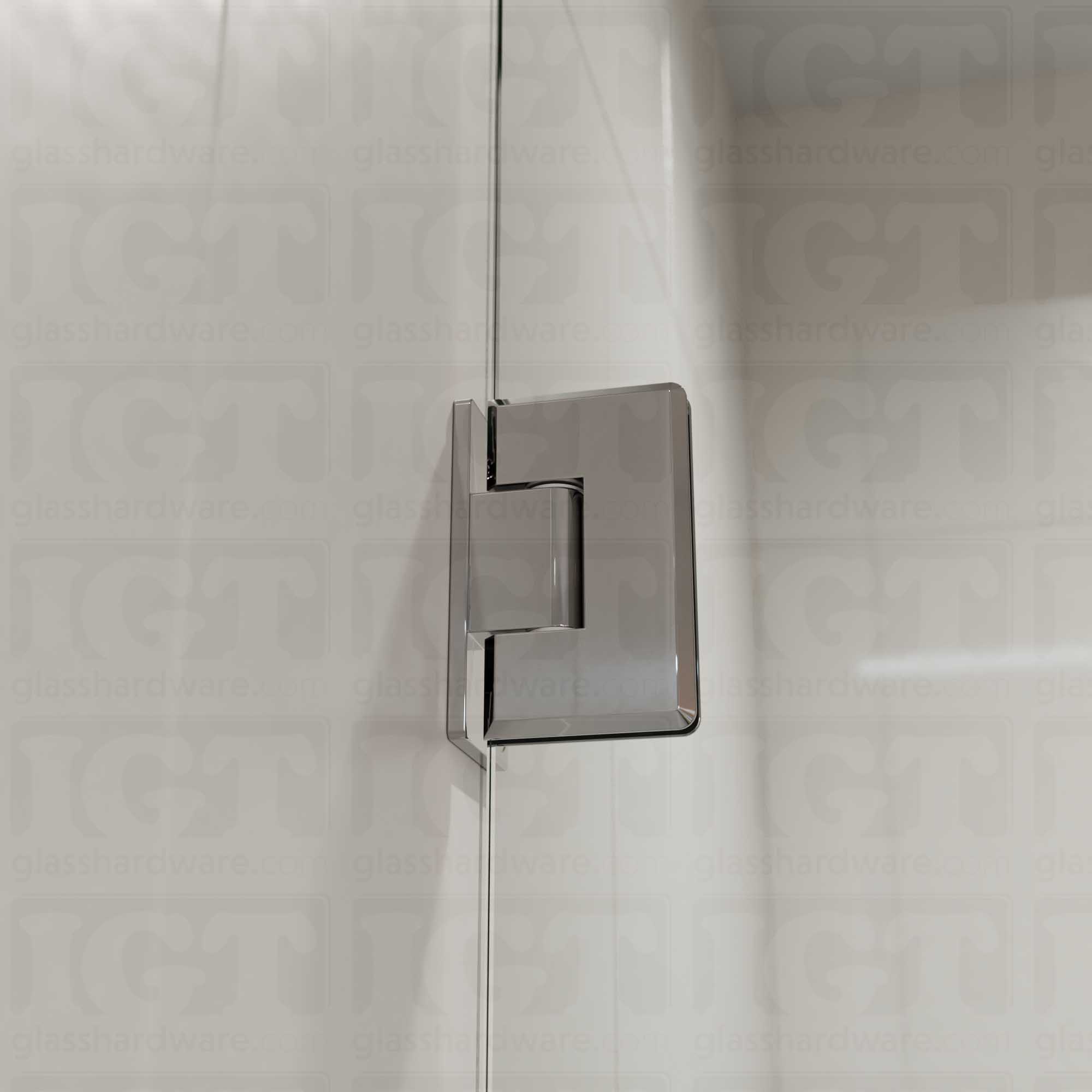 A close-up view of the Heavy Duty Wall-to-Glass Offset Back Bilboa Hinge installed on a modern shower door, showcasing it's rounded corners and beveled edges. Chrome Polished.