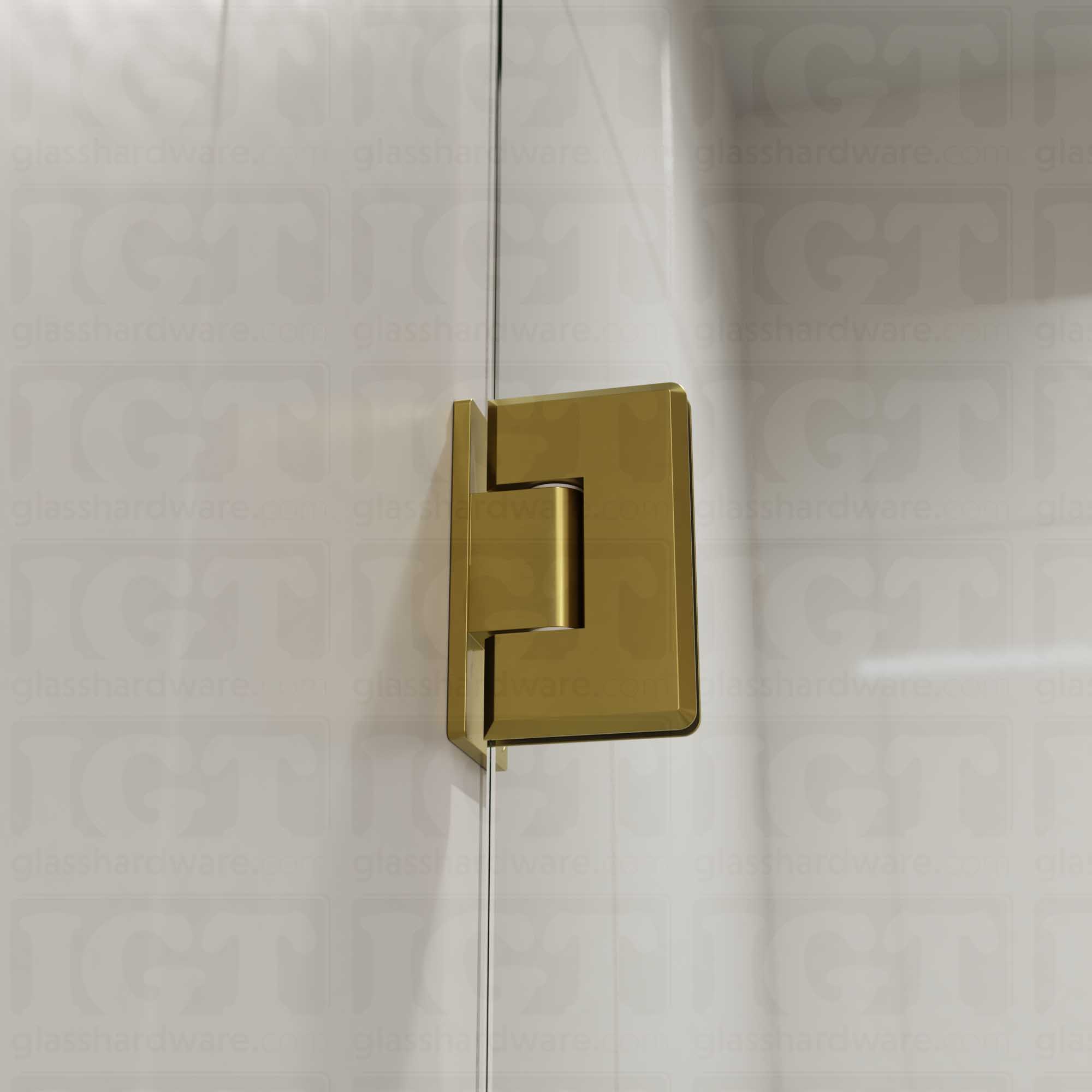 A close-up view of the Heavy Duty Wall-to-Glass Offset Back Bilboa Hinge installed on a modern shower door, showcasing it's rounded corners and beveled edges. Gold Brushed.