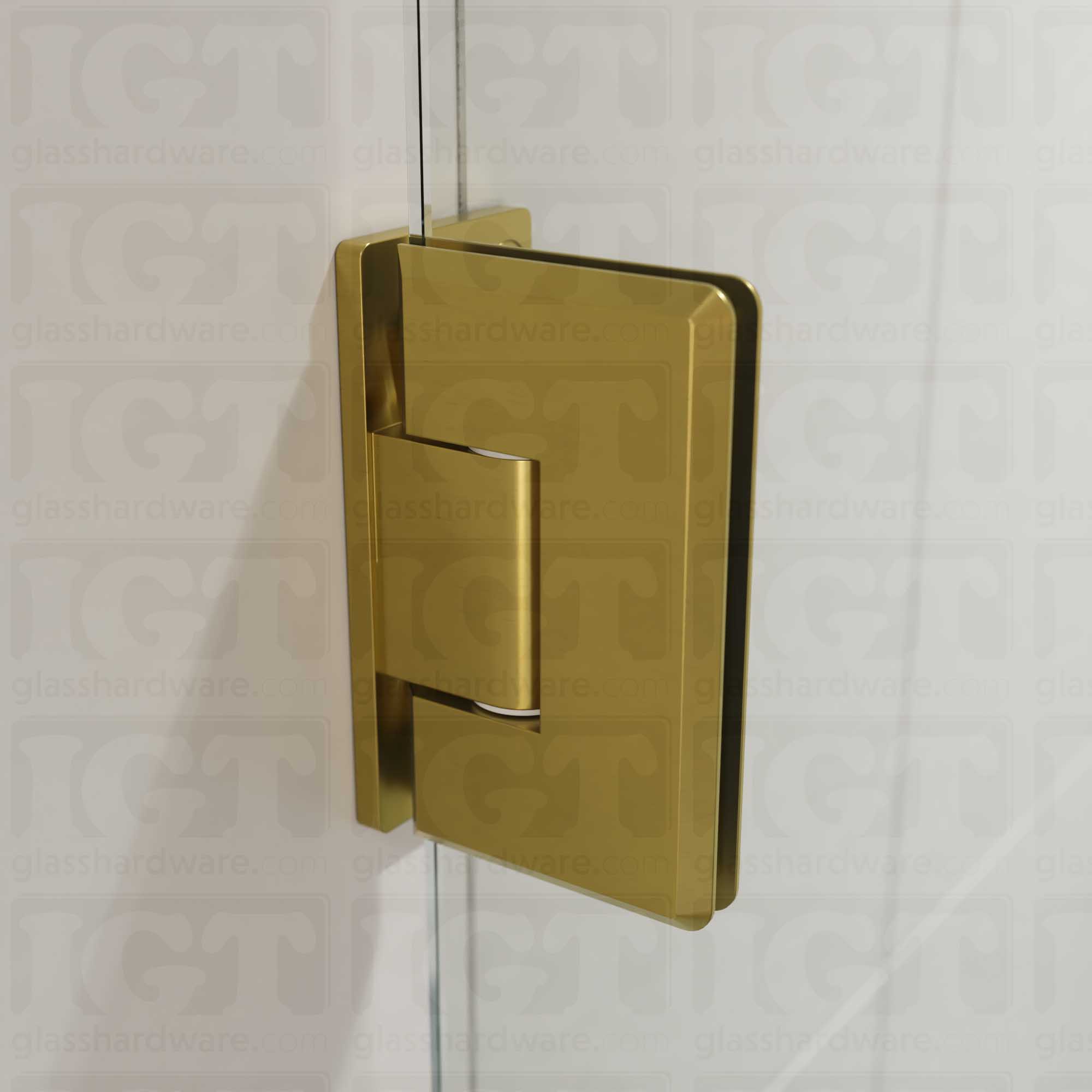 A close-up view of the Heavy Duty Wall-to-Glass Offset Back Bilboa Hinge installed on a modern shower door, showcasing its Gold Brushed finish in more detail.