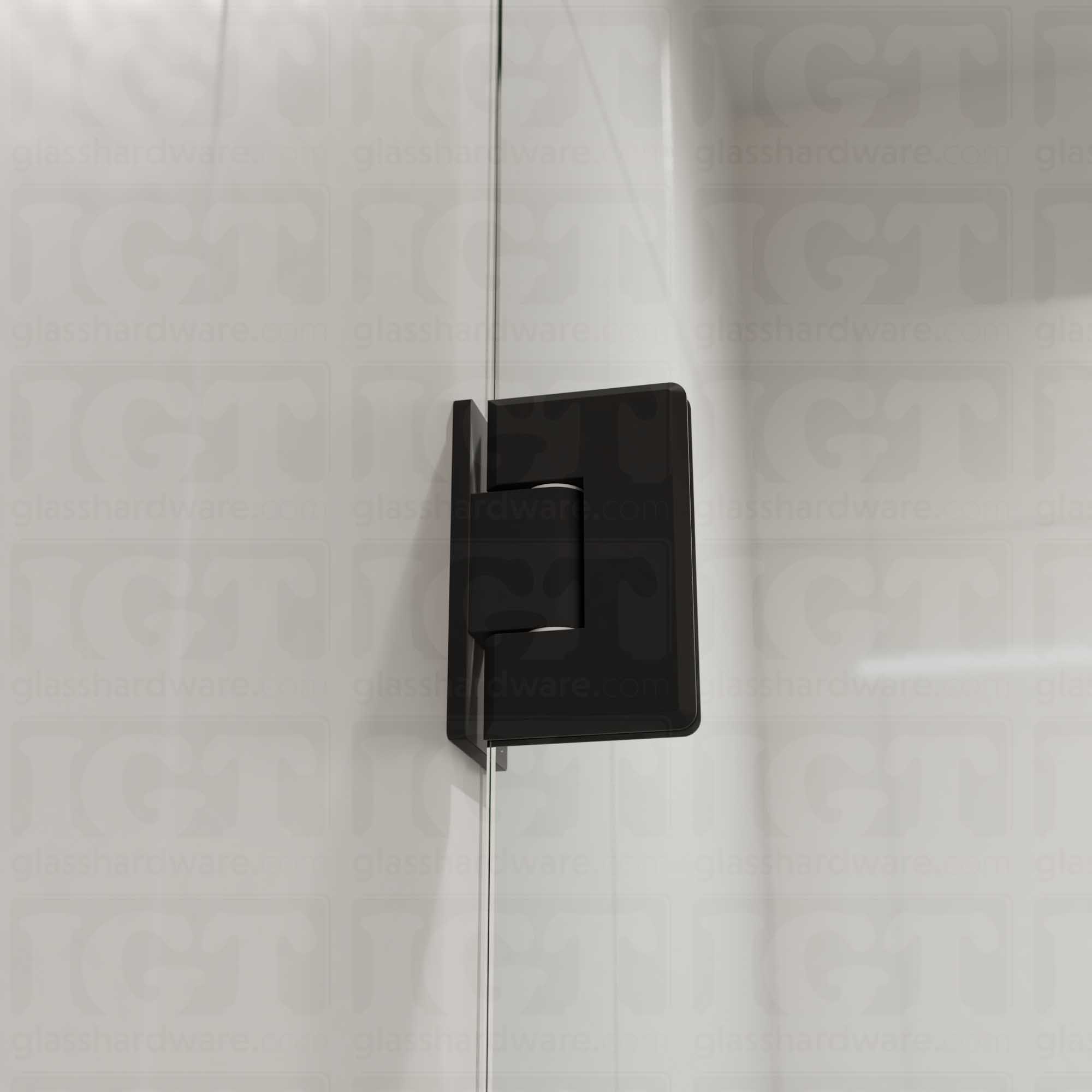 A close-up view of the Heavy Duty Wall-to-Glass Offset Back Bilboa Hinge installed on a modern shower door, showcasing it's rounded corners and beveled edges. Matte Black.