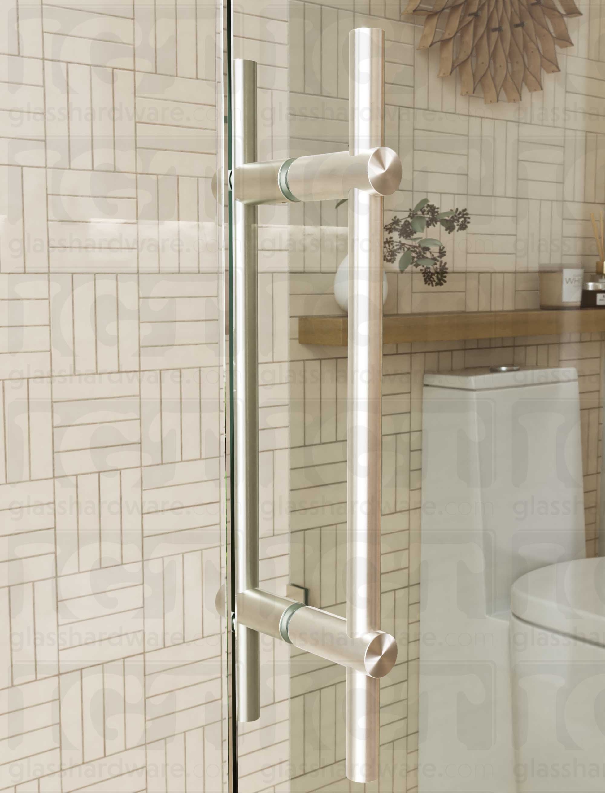 Close up view of the 16" Round Adjustable Ladder Handle installed on a glass shower door. The handle's adjustable posts are configued to 14" center-to-center, and are firmly secured to the glass panel. Brushed Nickel.