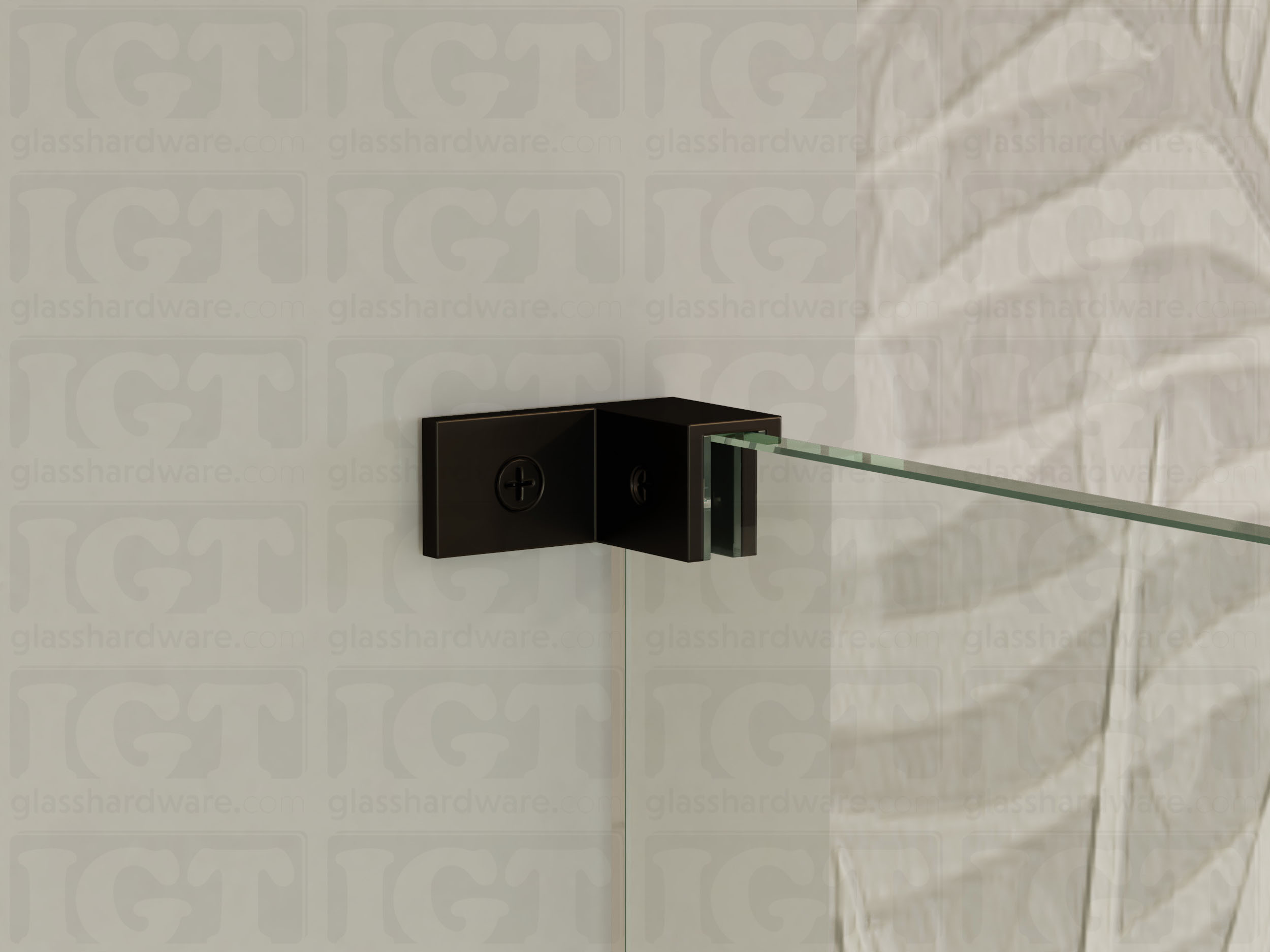 A close up of the Right Wall-to-Glass Sleeve Over Clamp installed on a frameless glass shower enclosure. The clamp is securely mounted to the shower's wall, providing additional support to the overall installation. Oil Rubbed Bronze.