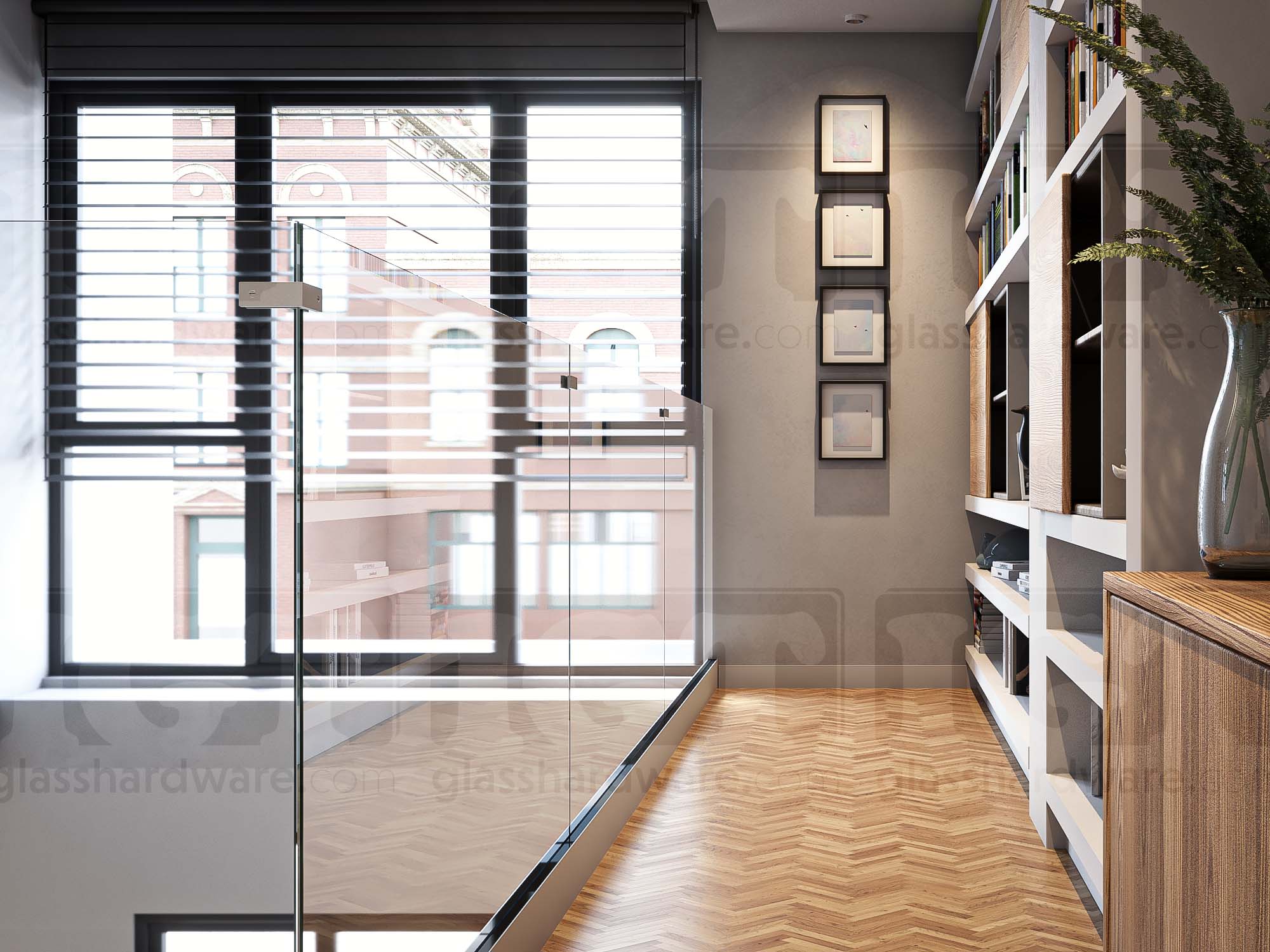 A modern second-floor hallway with frameless glass railing overlooking the space below, secured by 180 Degree Glass Bracing Clamps joining its glass panels together. Brushed Stainless.