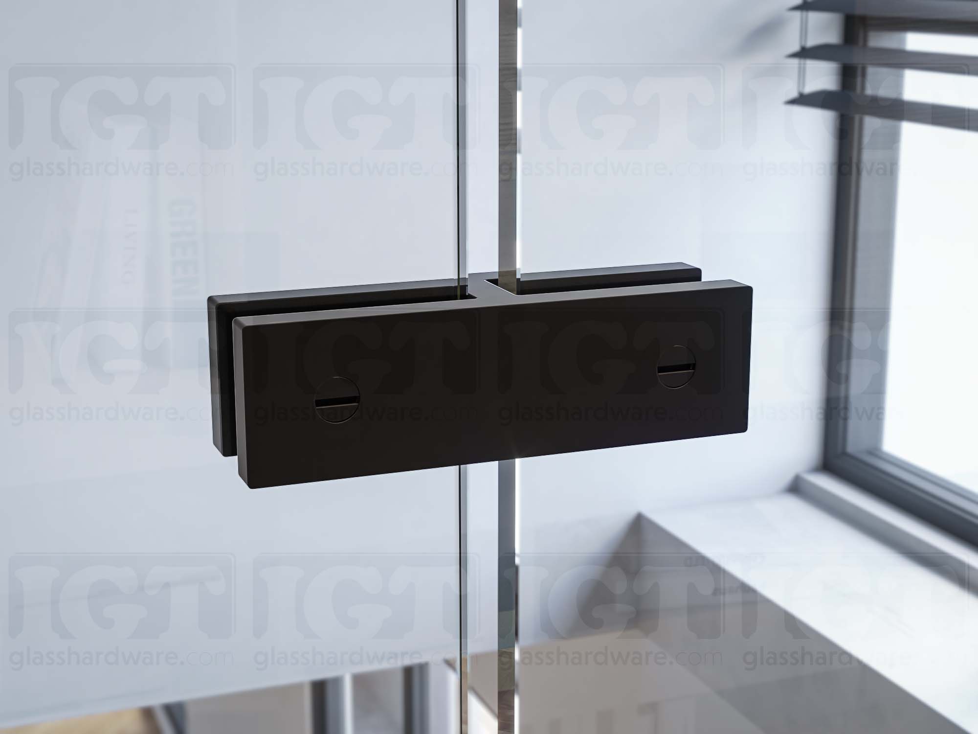 A close up of the 180 Degree Glass Bracing Clamp installed between two glass panels. The bracing clamp's grub screws tighten to securely fasten it to the glass. Matte Black.