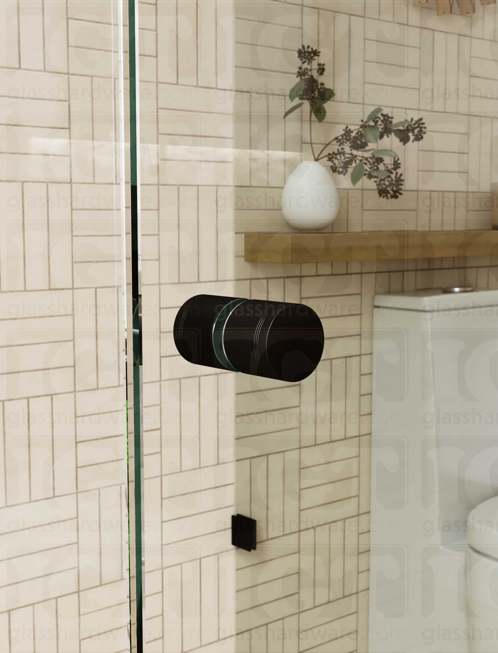 A close up of the Contemporary Style Door Knob installed on a glass shower door. The door knob's back-to-back design is tightly secured to the glass door. Oil Rubbed Bronze.