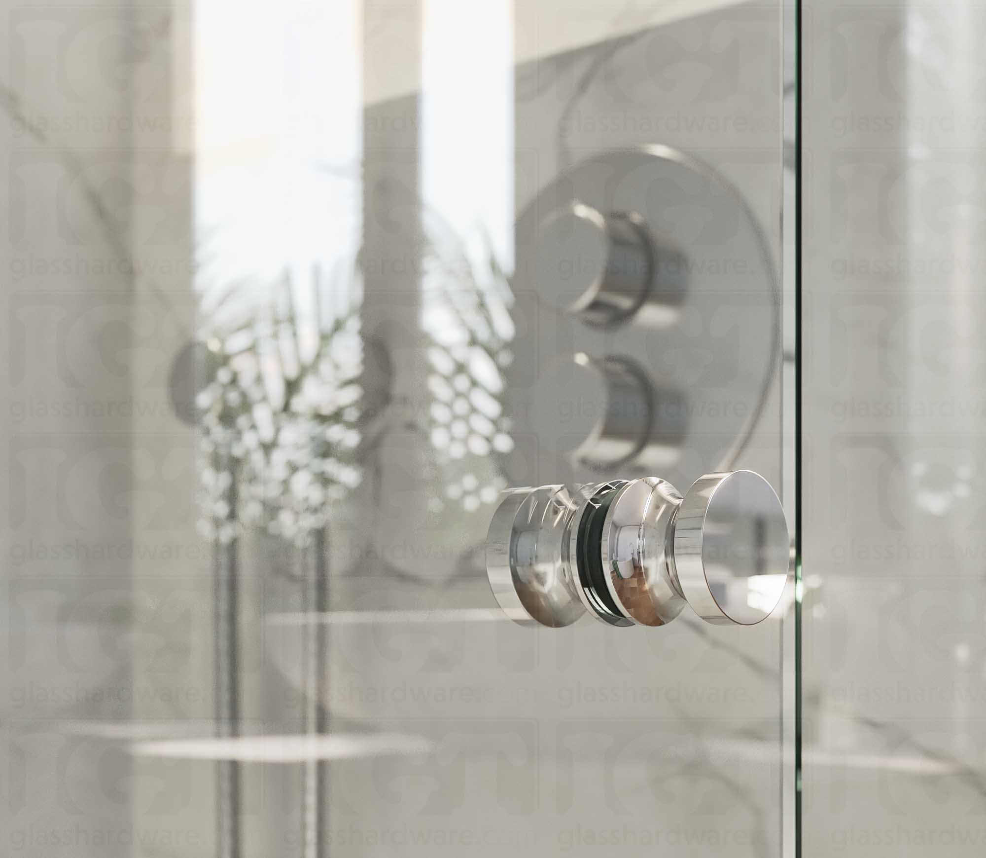 A close up of the European Style Back-to-Back Door Knob installed on a glass shower door. The door knob's back-to-back design is tightly secured to the glass door. Chrome Polished.