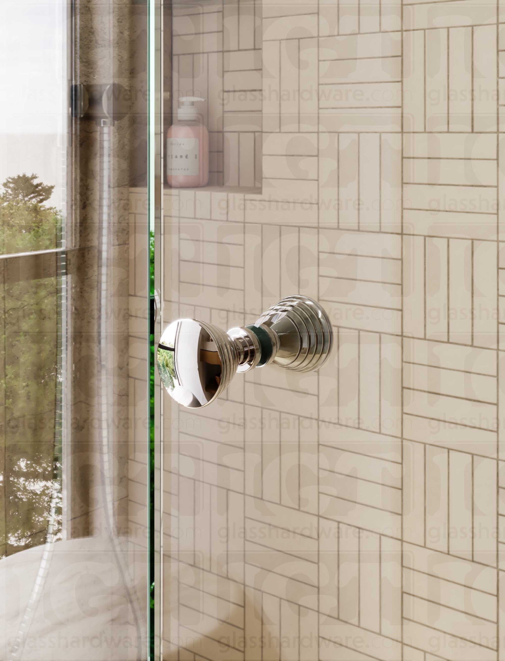 A close up of the Ribbed Bow Tie Style Back-to-Back Door Knob installed on a glass shower door. Chrome Polished.