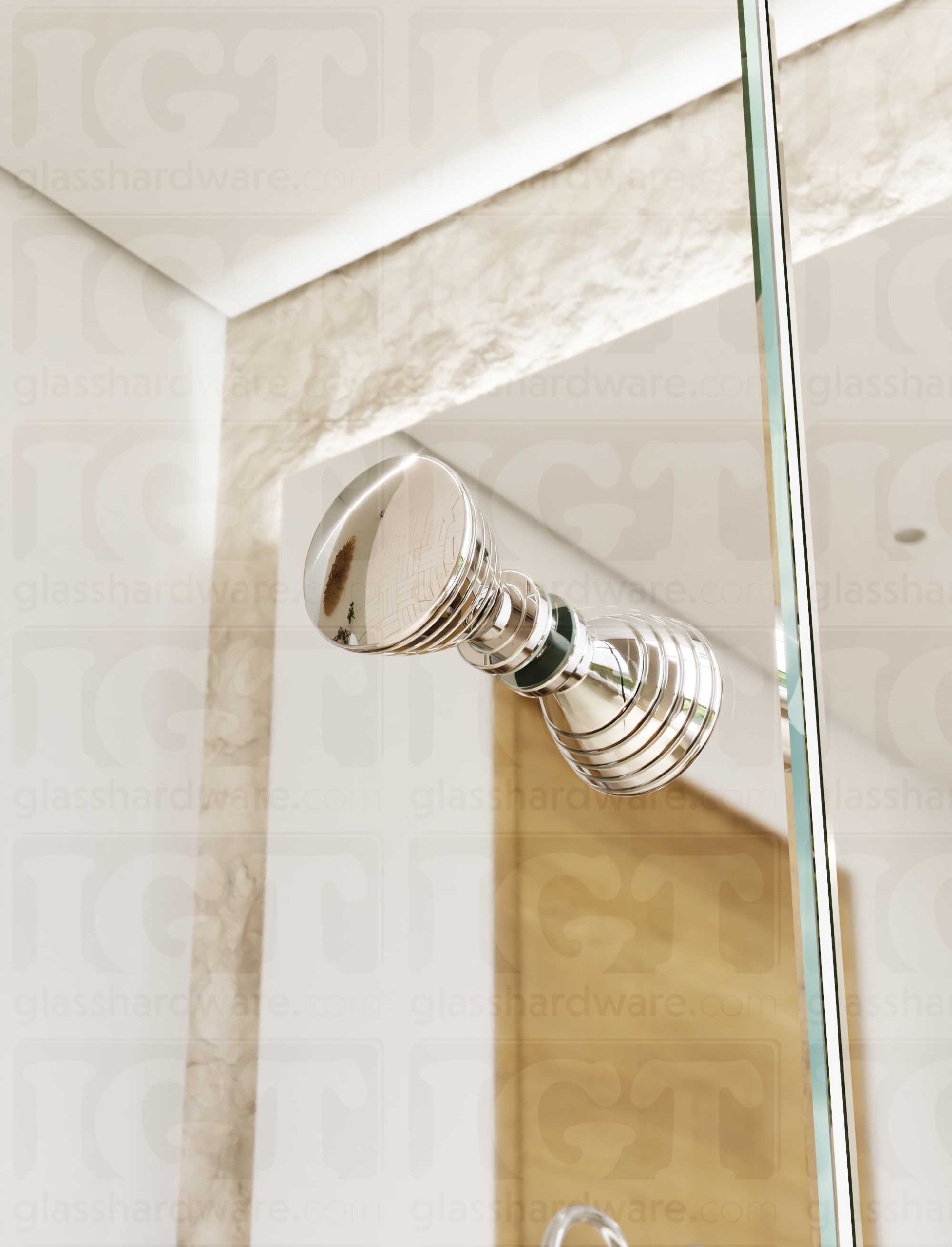 A close up from below of the Ribbed Bow Tie Style Back-to-Back Door Knob installed on a glass shower door. Soft natural light highlights the knob's Chrome Polished finish.