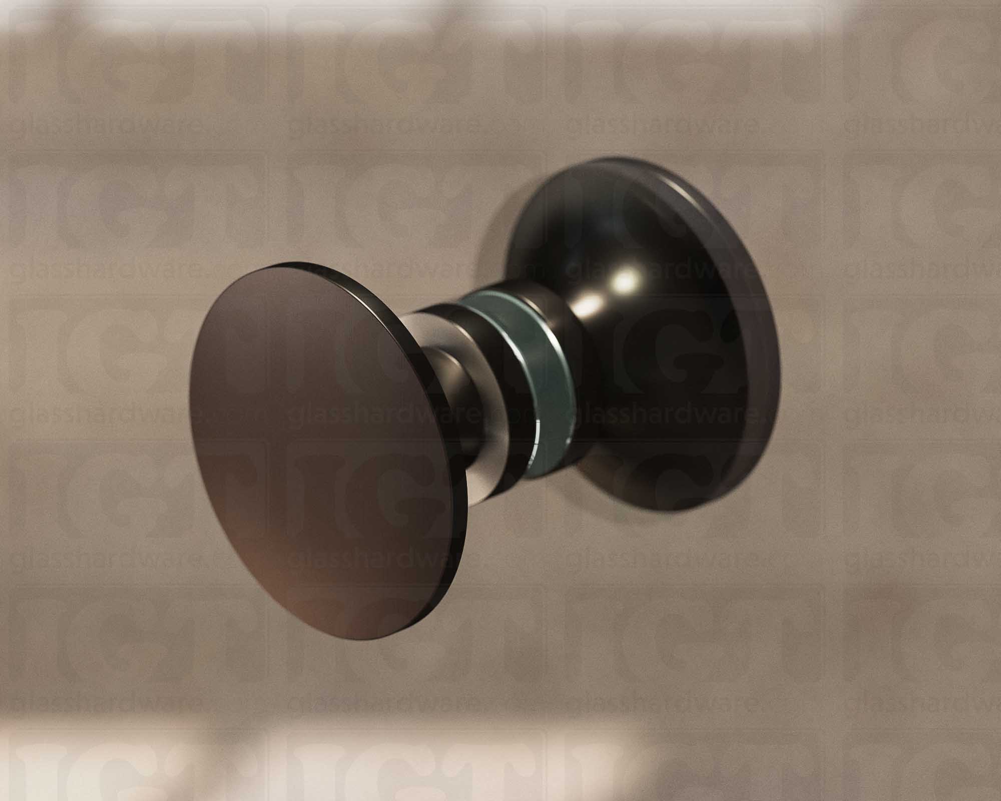 A close up of the Traditional Style Back-to-Back Door Knob installed on a glass shower door. Soft natural light highlights the knob's Oil Rubbed Bronze finish.